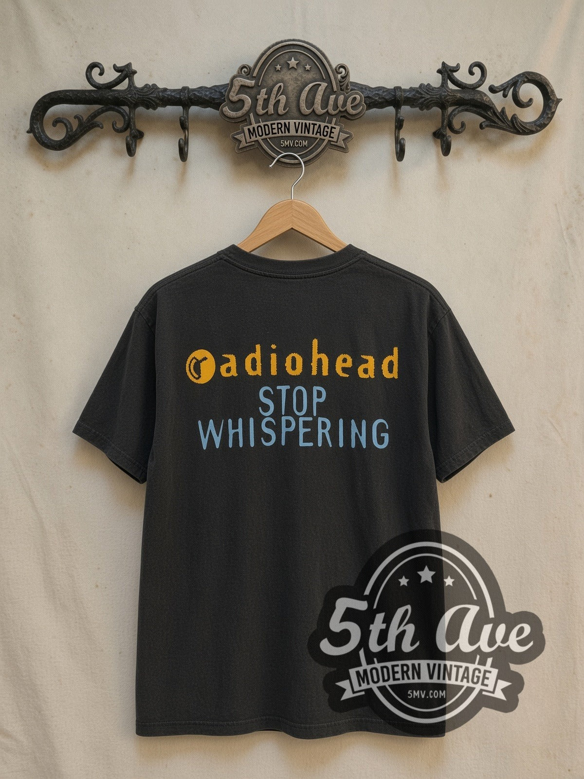 Radiohead Stop Whispering vintage band t-shirt in black, back view on a display rack