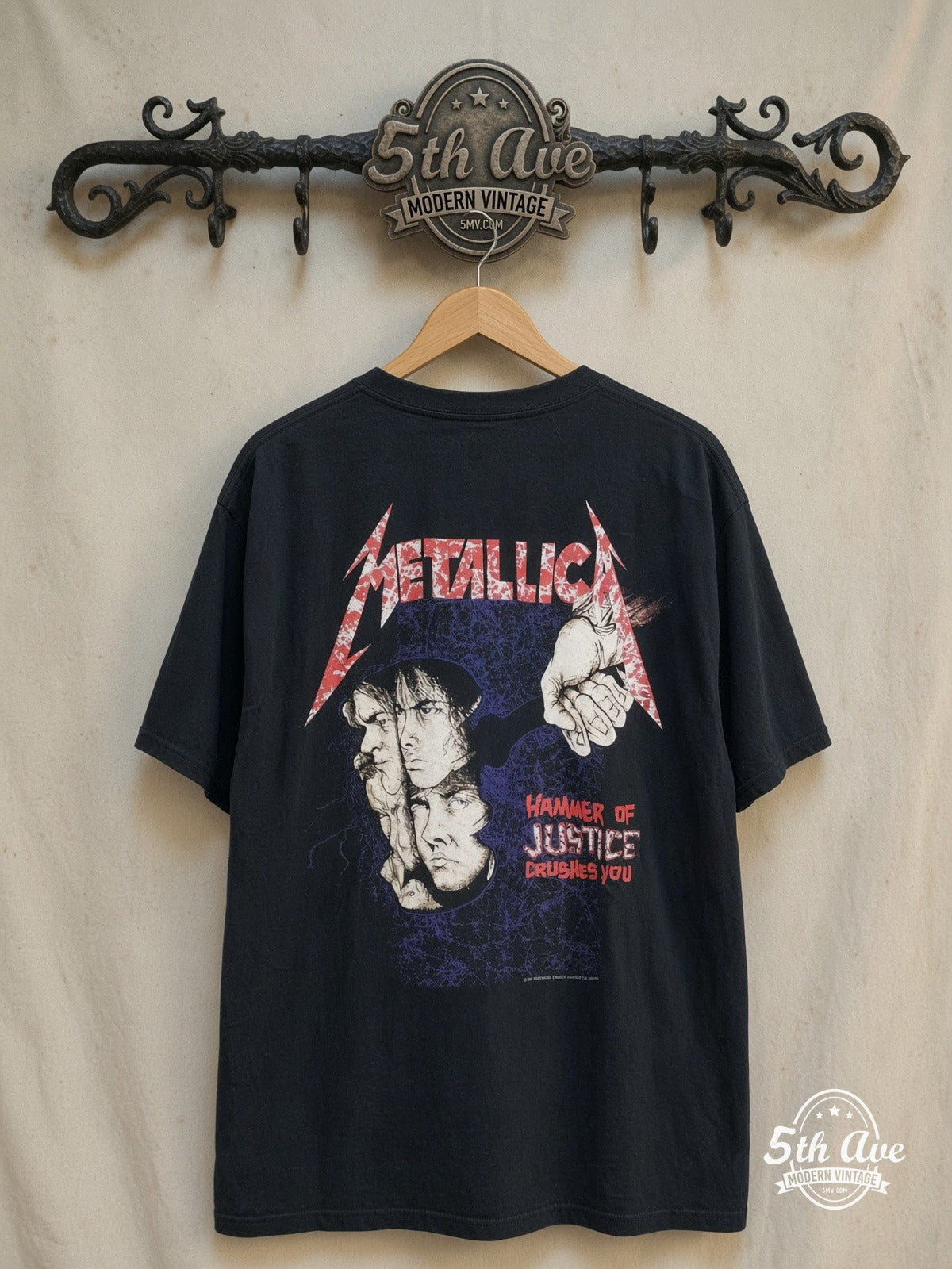 Metallica – Damaged Justice Fist Through Skull – Vintage Band T-Shirt — back on locked cream ornate 5th Ave rack