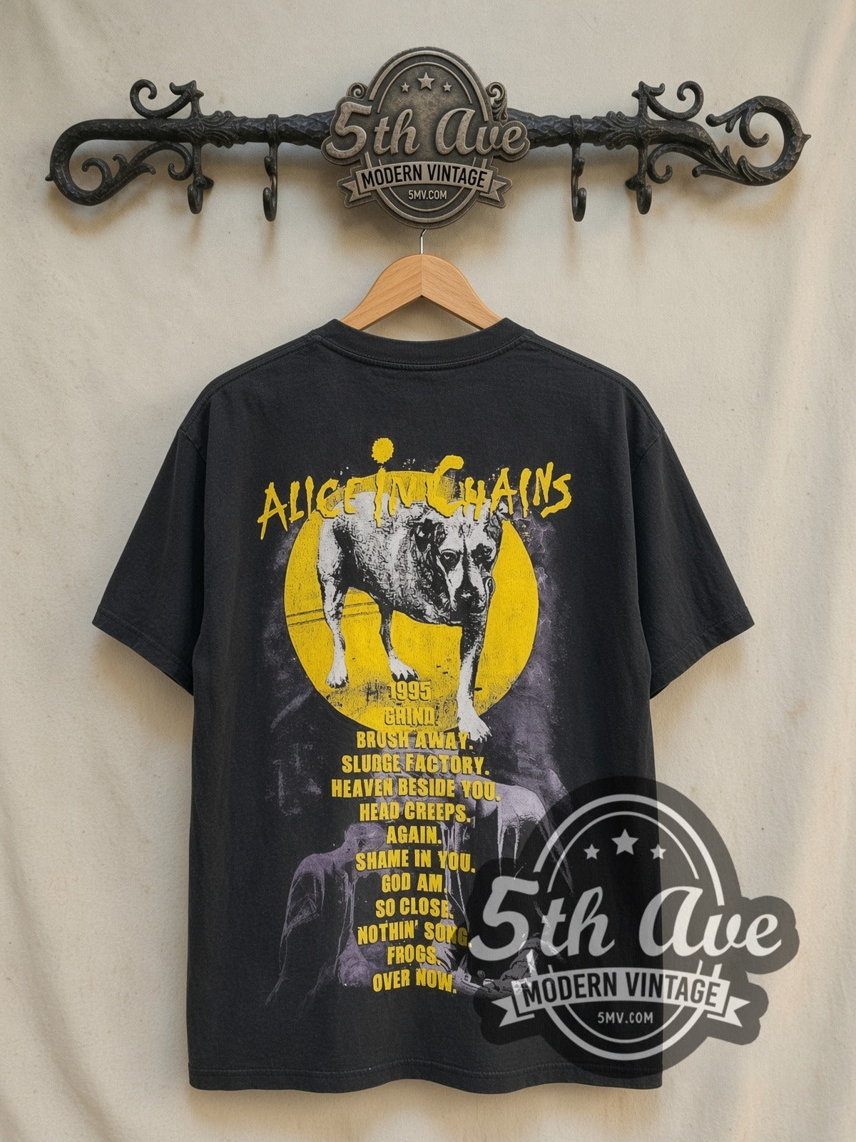 Alice in Chains Grind / Sunshine the Three-Legged Dog vintage band t-shirt in black, back view on a display rack