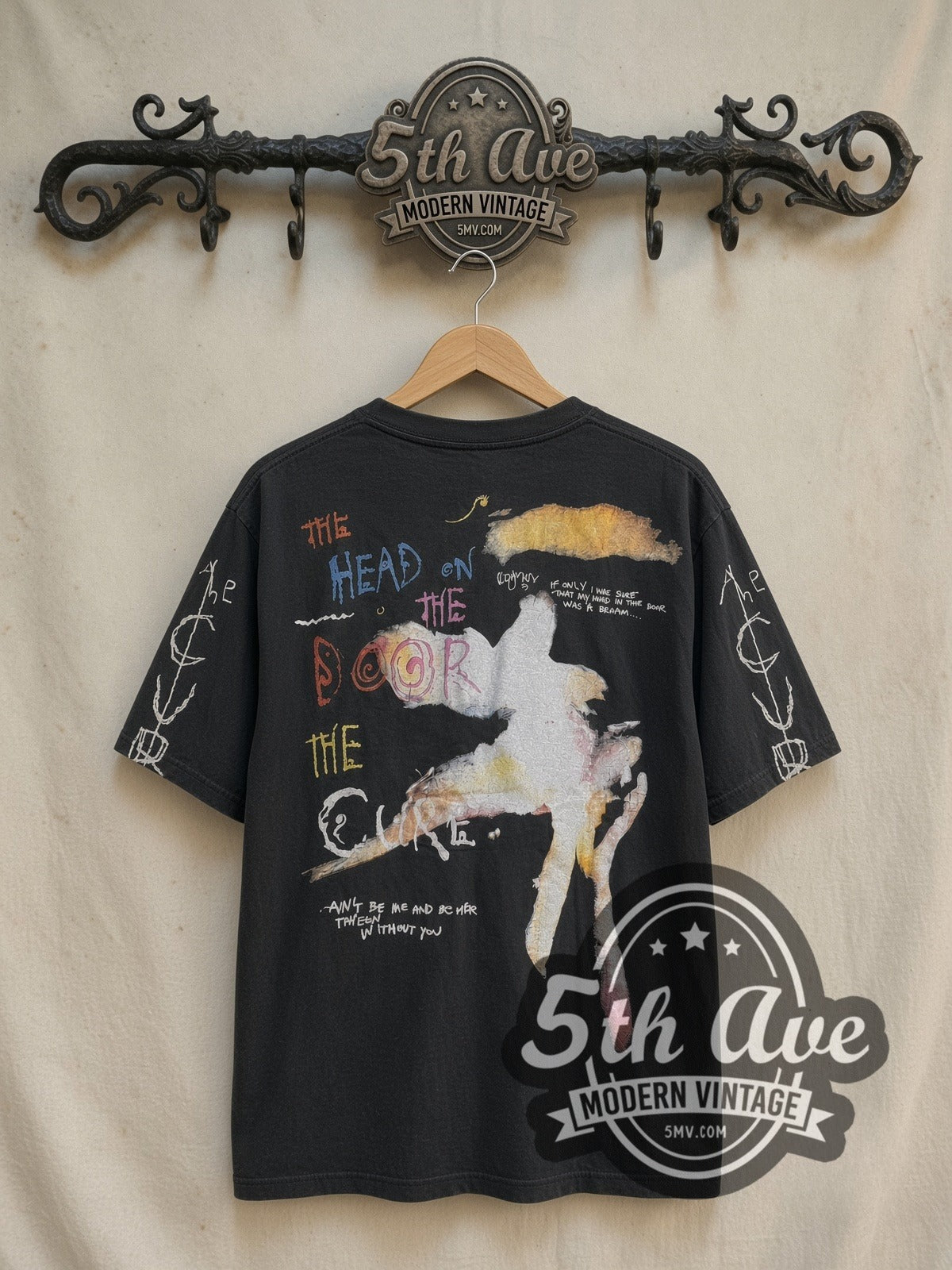 The Cure The Head on the Door Long Sleeve vintage band t-shirt in black, back view on a display rack