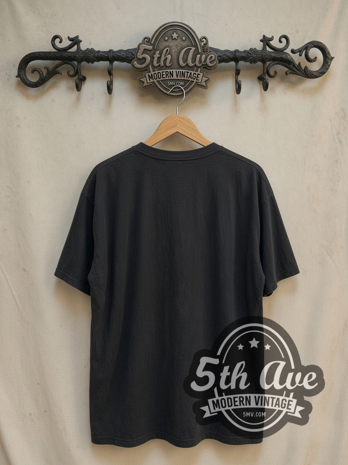 The Pogues Pogue Mahone vintage band t-shirt, back view on a display rack