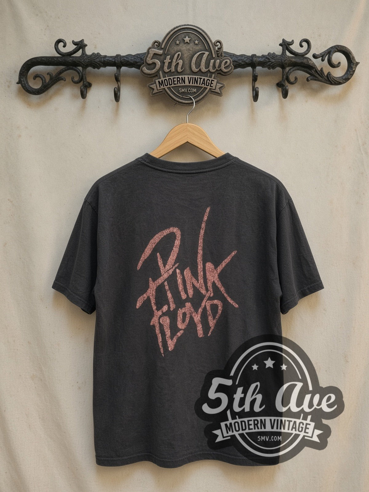 Pink Floyd Wall and Derby Figure vintage band t-shirt, back view on a display rack