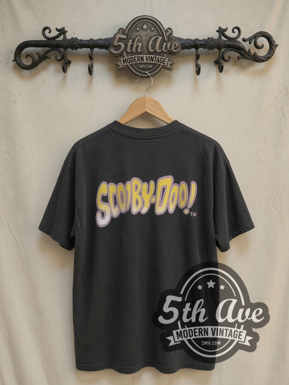 Scooby-Doo The Mystery Machine vintage cartoon tee, back view on a display rack