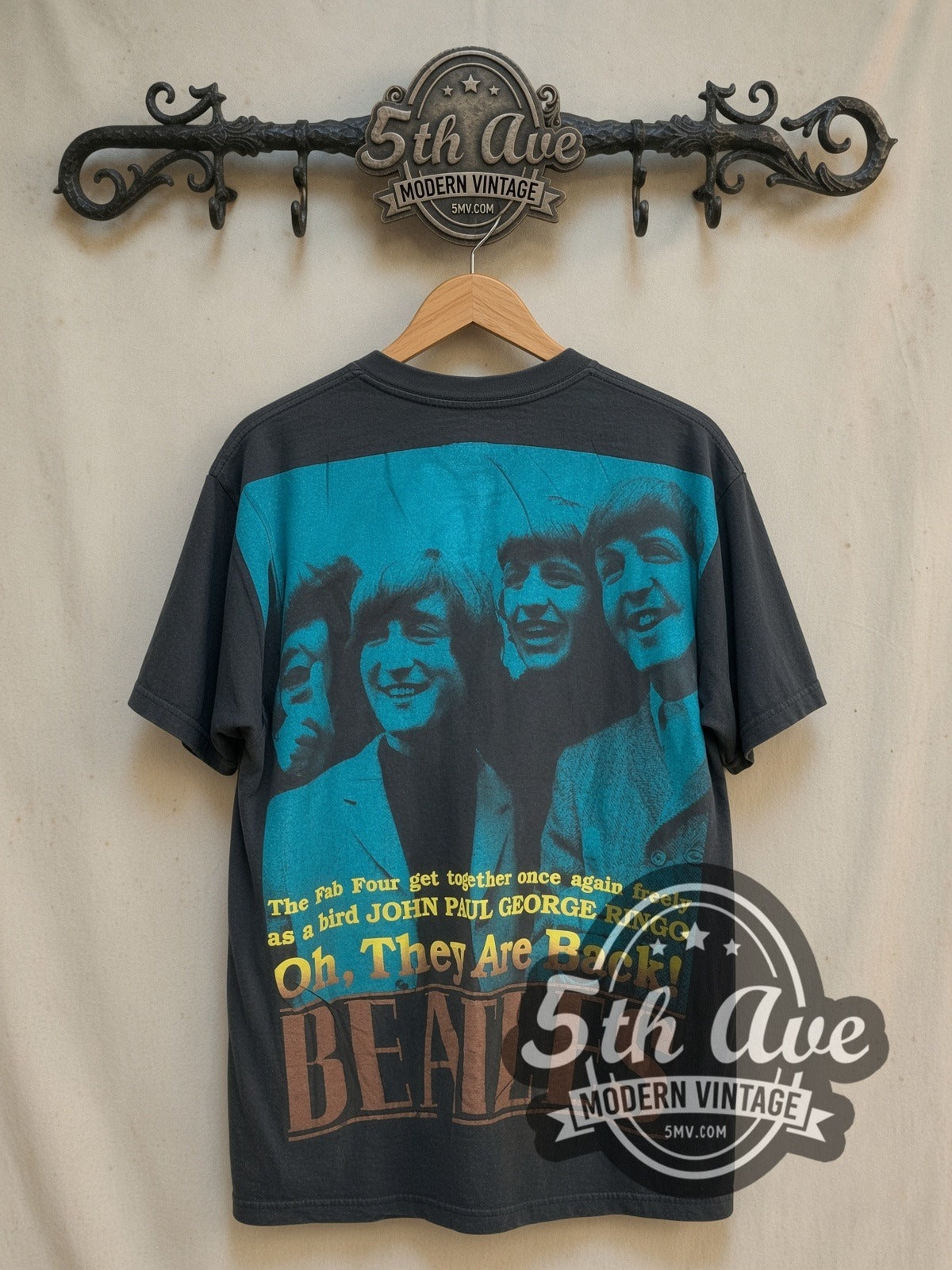 The Beatles Oh They Are Back! all-over-print vintage band t-shirt, back view on a display rack