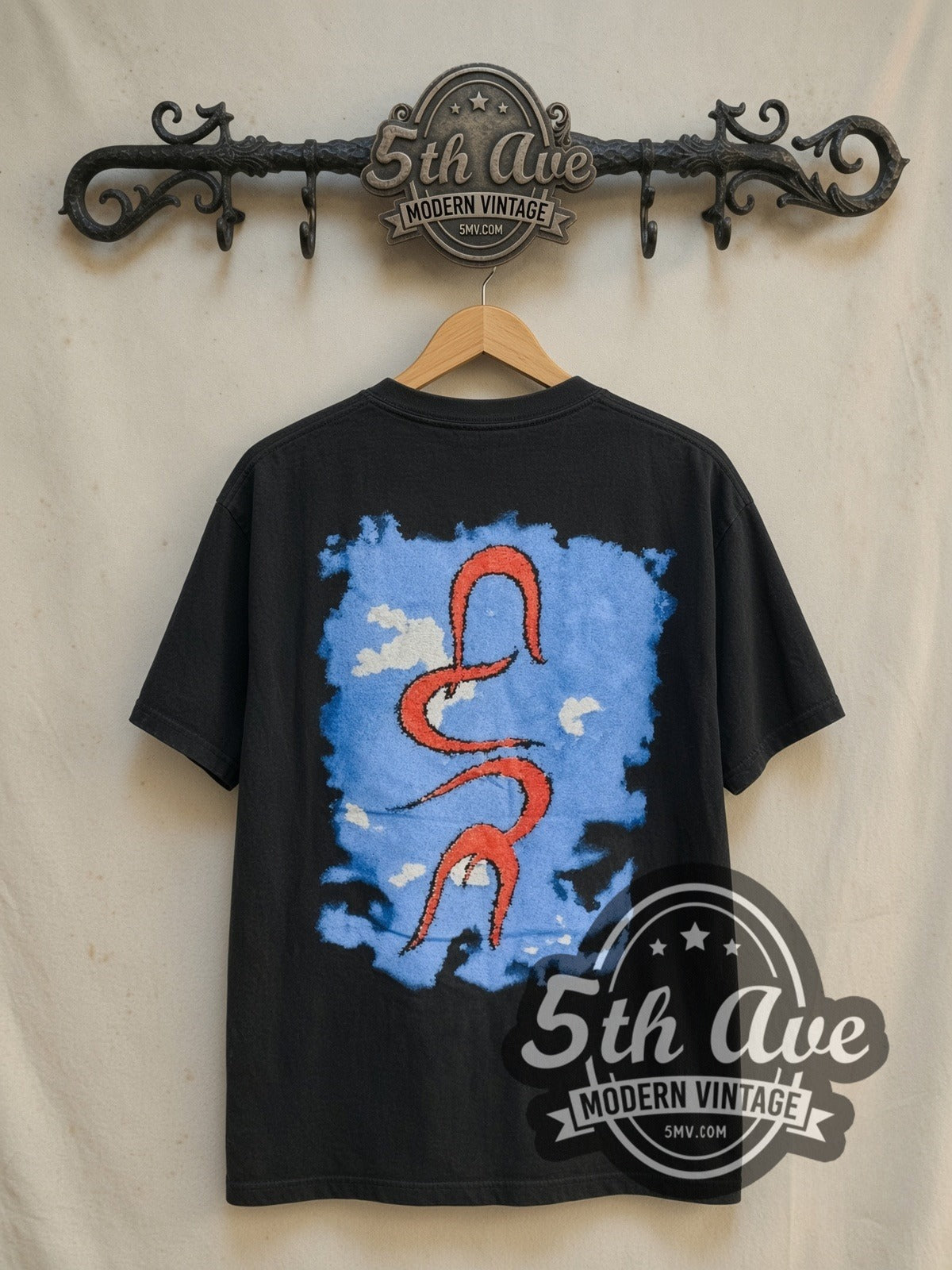 The Cure Wish Tour 1992 vintage band t-shirt in black, back view on a display rack