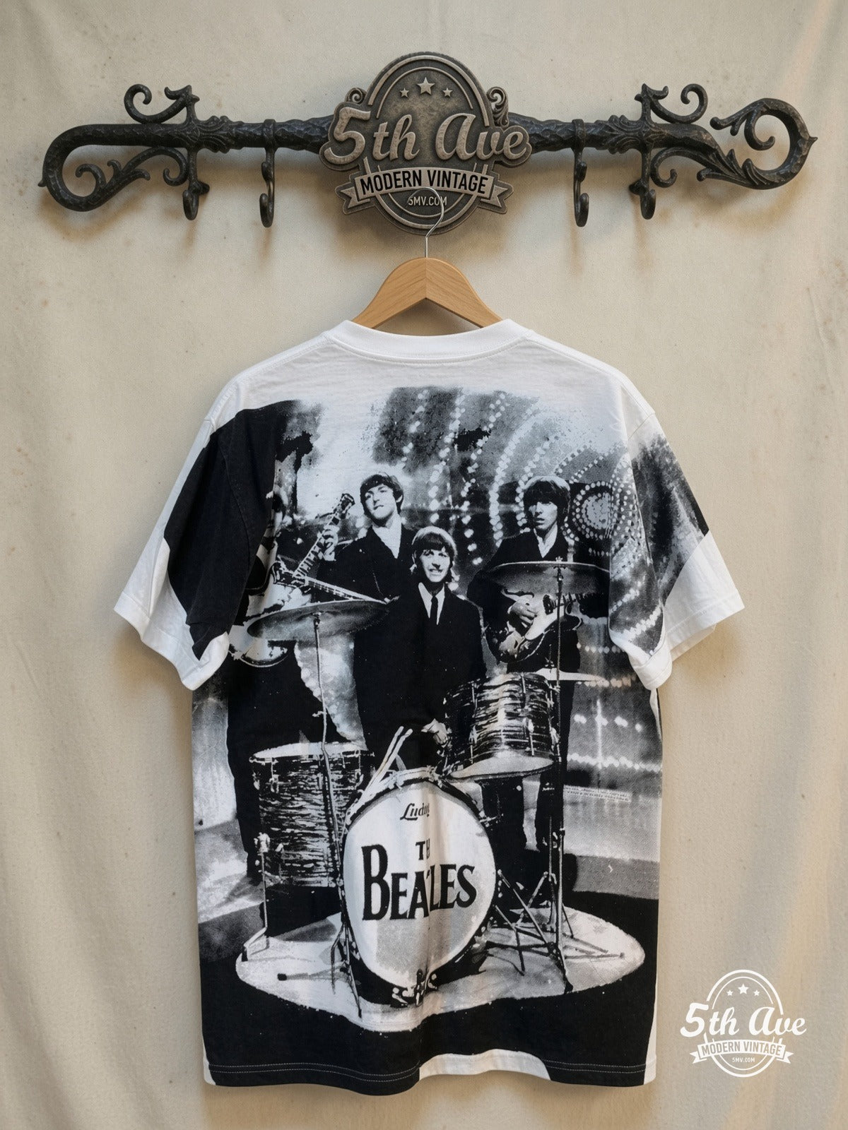 The Beatles – Live Stage Ludwig Drum White All Over Print – Vintage Band T-Shirt — back on locked cream ornate 5th Ave rack