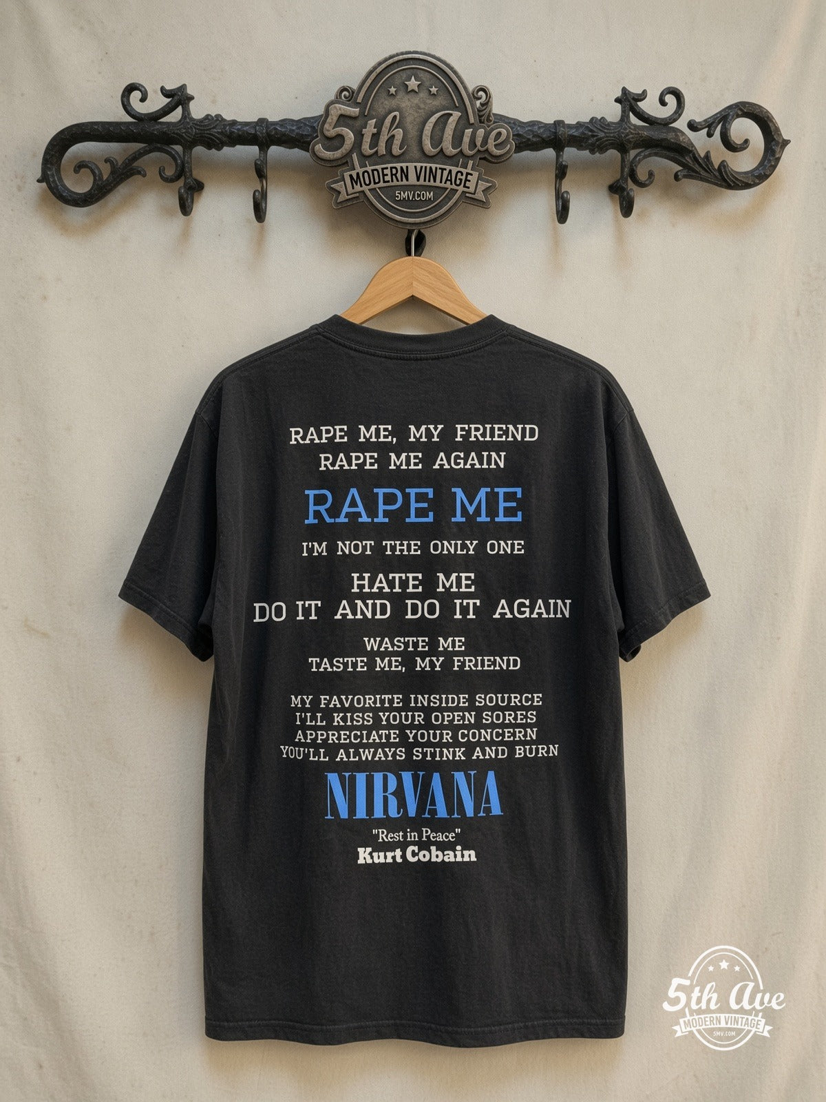 Nirvana – Rape Me – Vintage Band T-Shirt — back on locked cream ornate 5th Ave rack