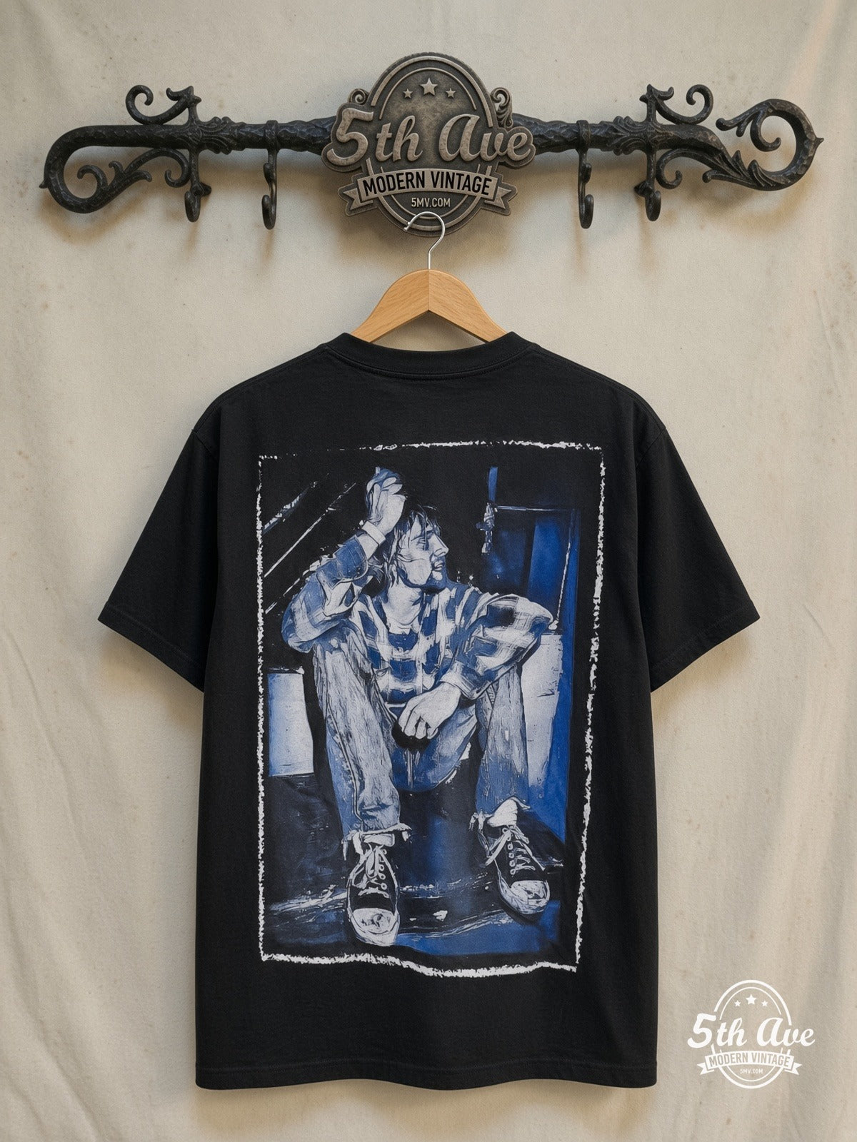 Nirvana – Kid Blue – Vintage Band T-Shirt — back on locked cream ornate 5th Ave rack