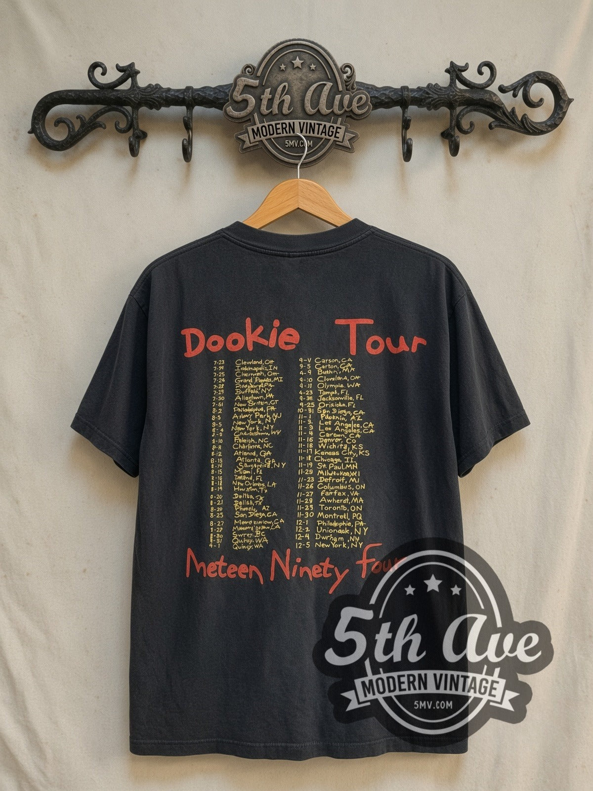 Green Day Dookie Tour 1994 vintage band t-shirt in black, back view on a display rack