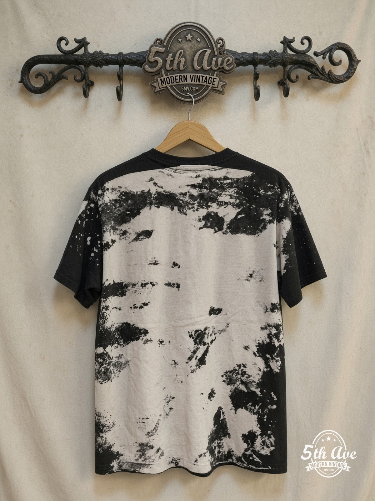 Nirvana Kurt Cobain Mosquito Head vintage band t-shirt, back view on a display rack