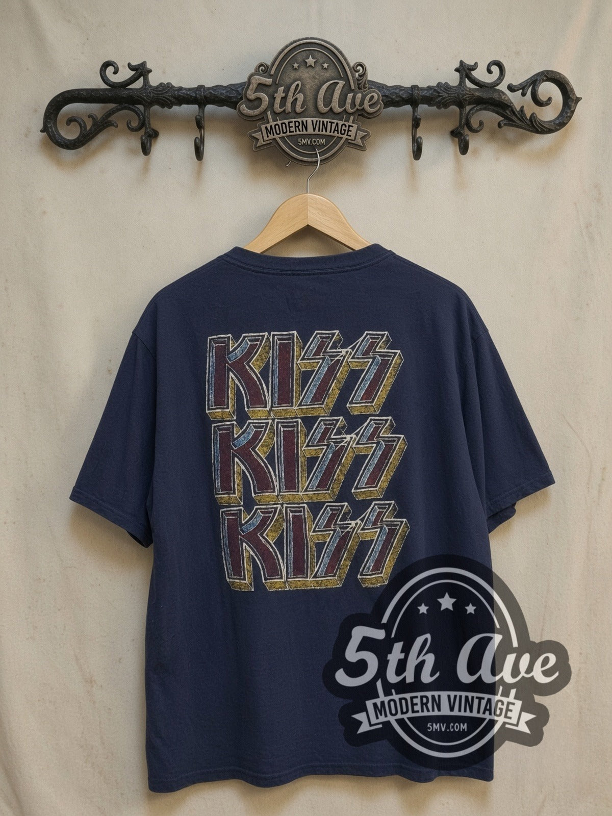 KISS Triple Logo vintage band t-shirt, back view on a display rack