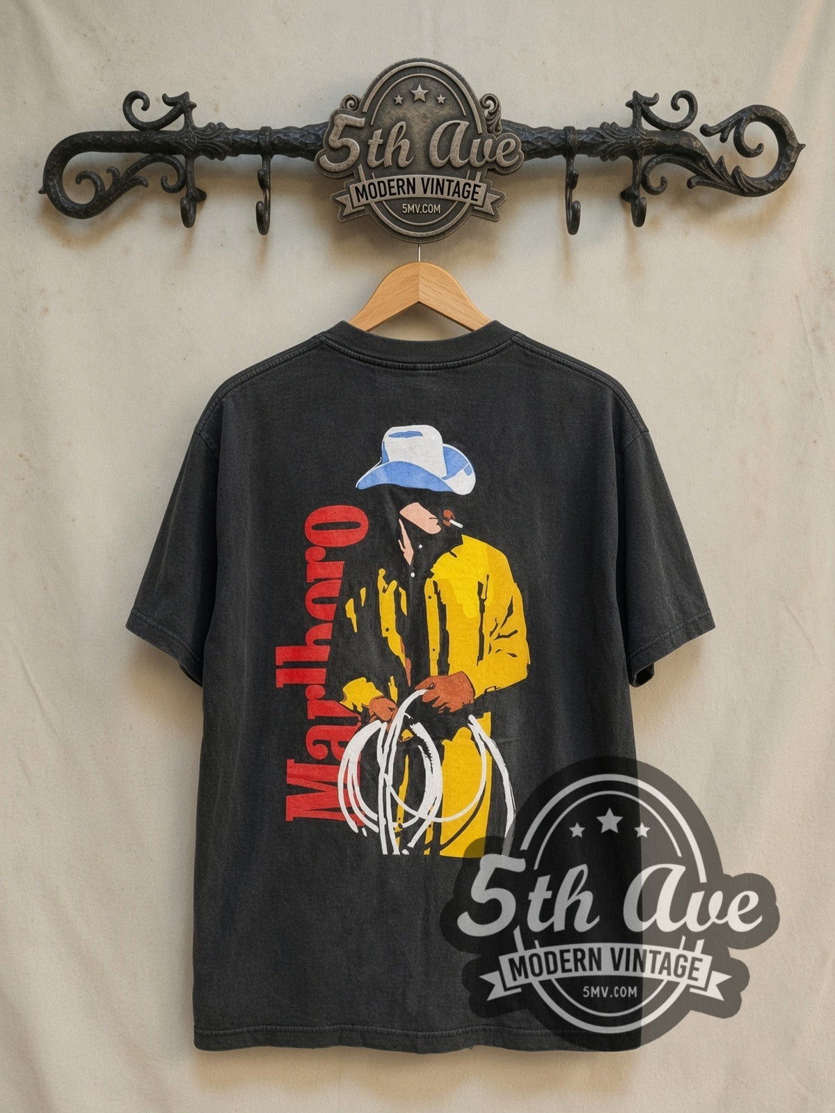 Marlboro Cowboy vintage graphic tee in black, back view on a display rack