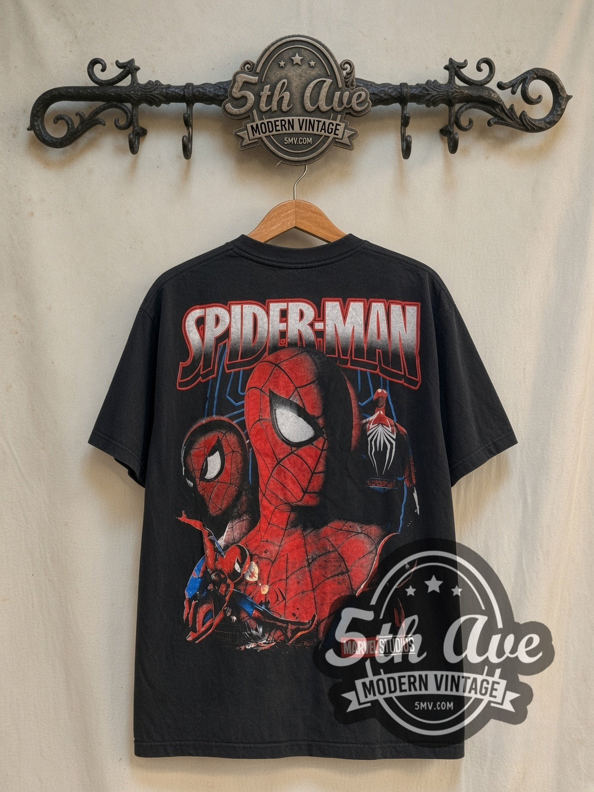 Spider-Man Marvel Studios Face Collage vintage graphic t-shirt, back view on a display rack