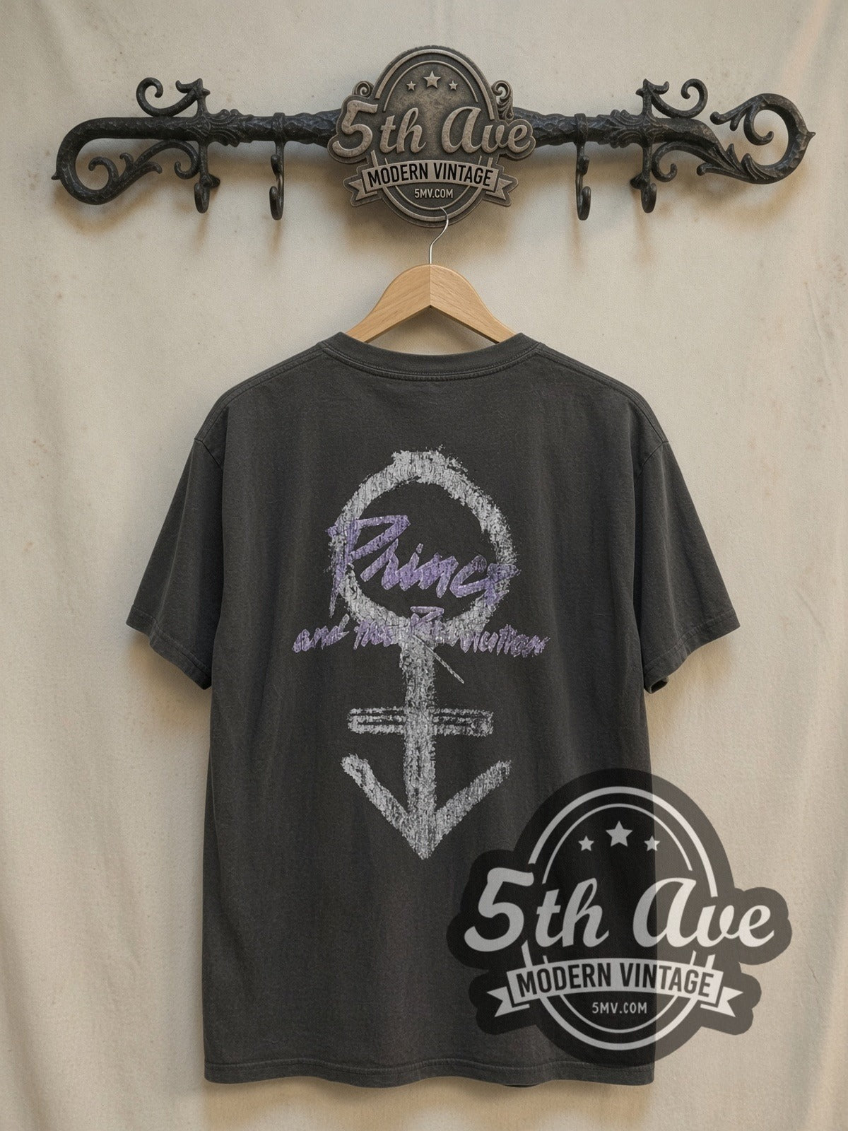 Prince Purple Rain vintage band t-shirt, back view on a display rack