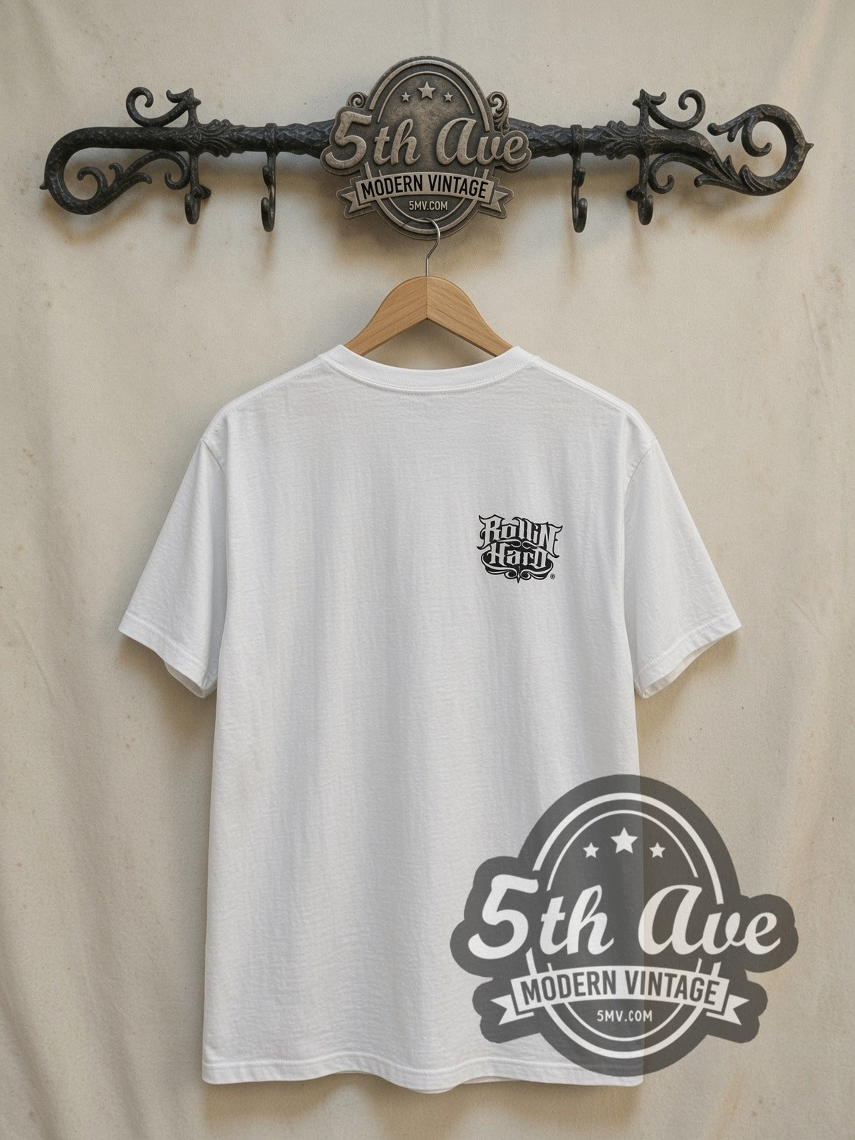 Rollin Hard White-on-White Lowrider Dreams vintage graphic tee in white, back view on a display rack