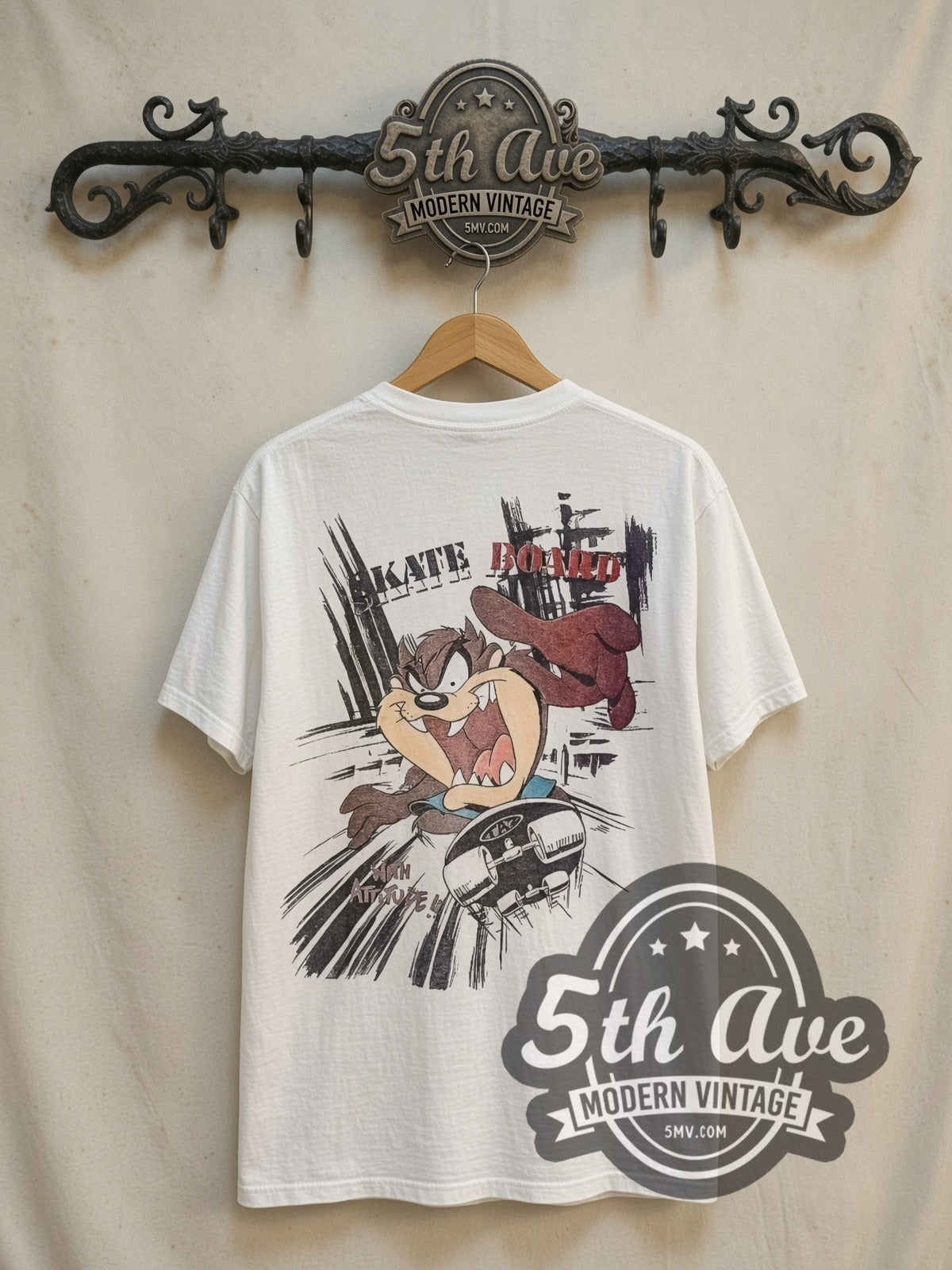 Looney Tunes Taz-Mania Skateboard vintage cartoon tee in white, back view on a display rack