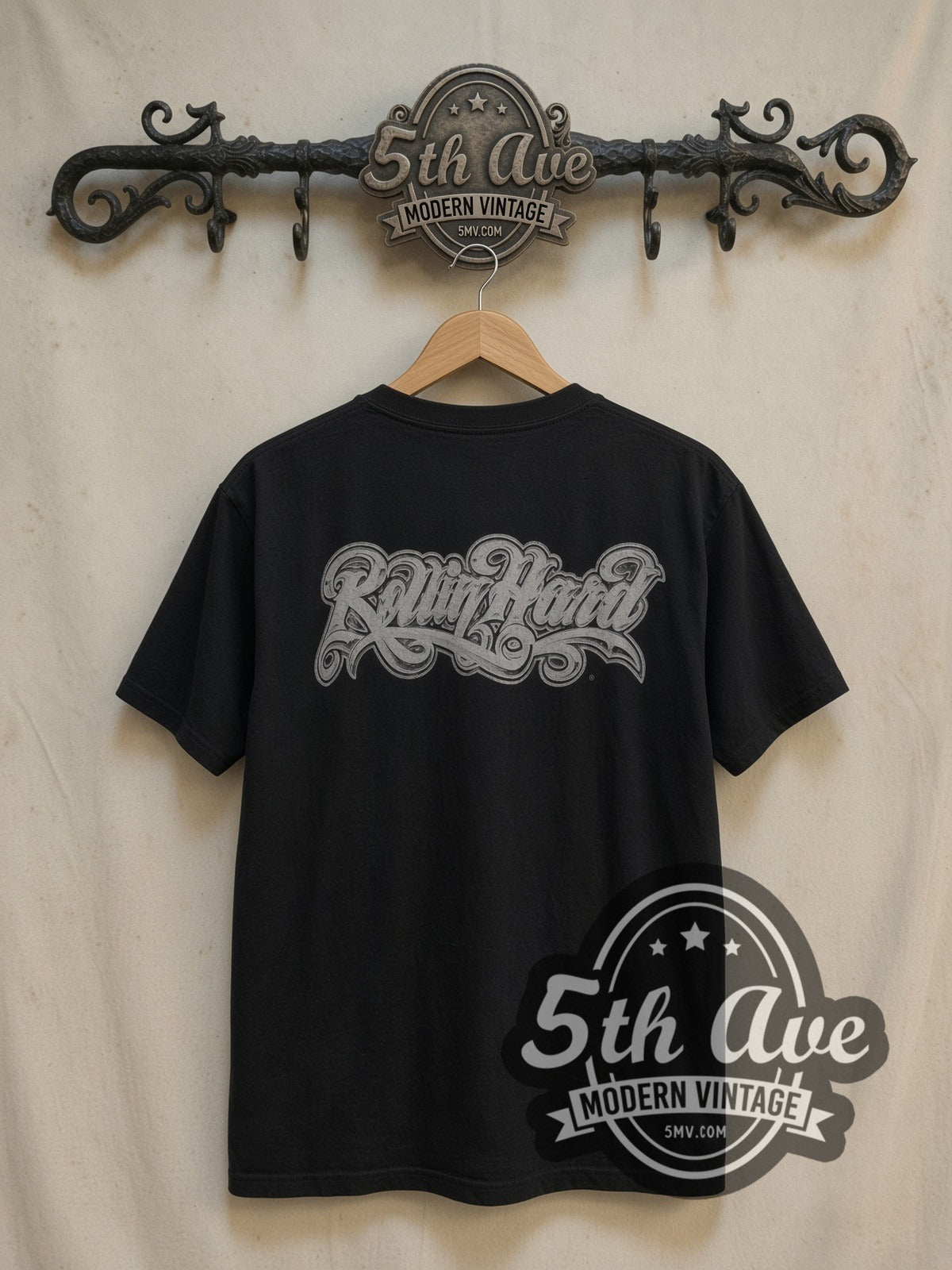 Rollin Hard '65 Chevy Impala Lowrider vintage graphic tee, back view on a display rack