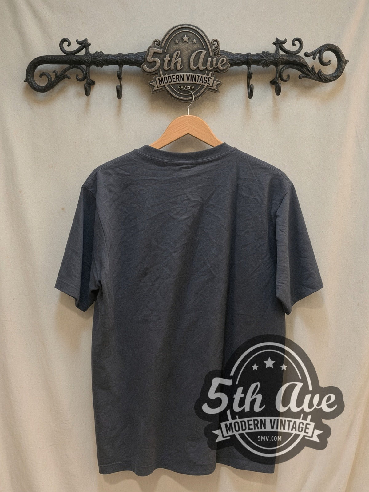 Coldplay Band Photo Logo vintage band t-shirt, back view on a display rack