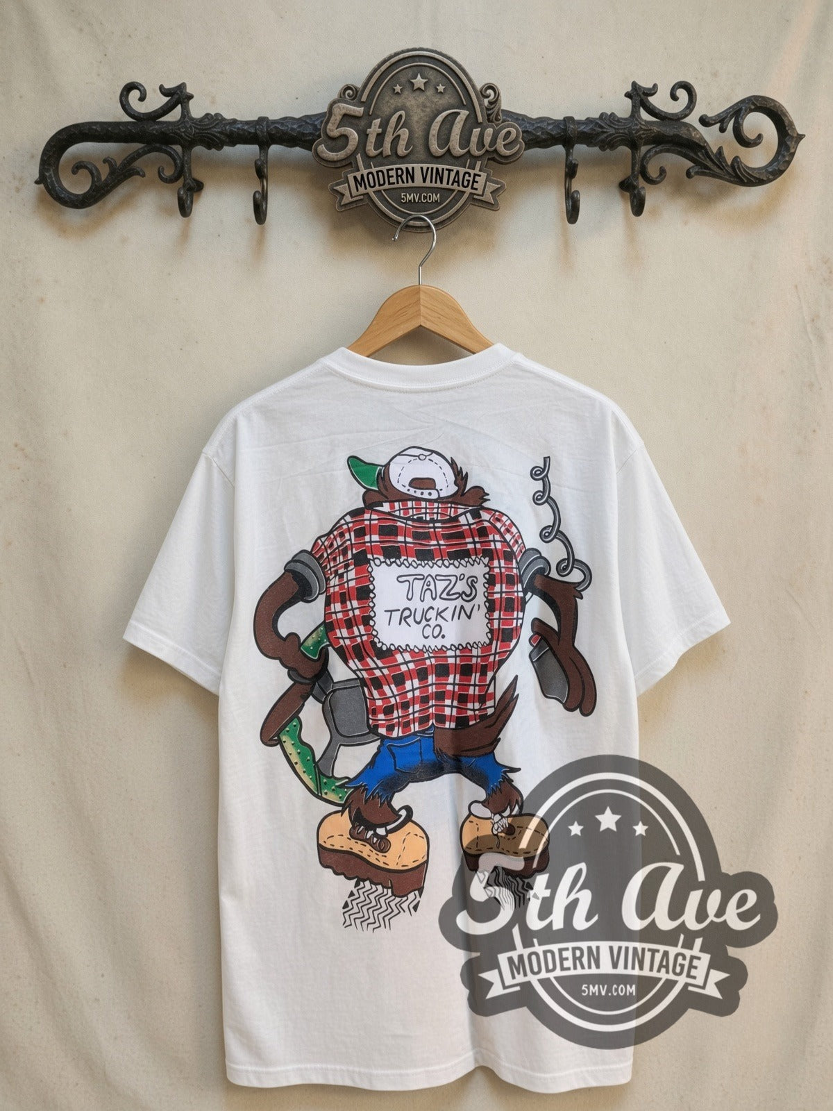 Looney Tunes Taz Truckin Company vintage cartoon tee, back view on a display rack