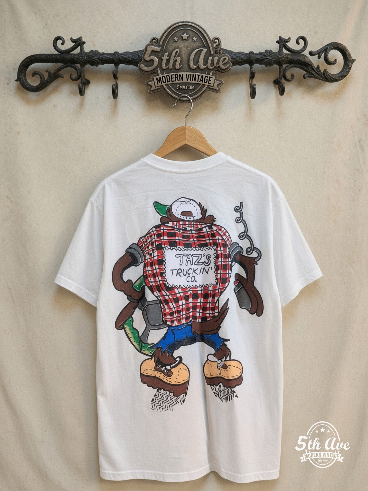Looney Tunes – Taz Truckin Company – New Vintage Graphic Tee — back on locked cream ornate 5th Ave rack