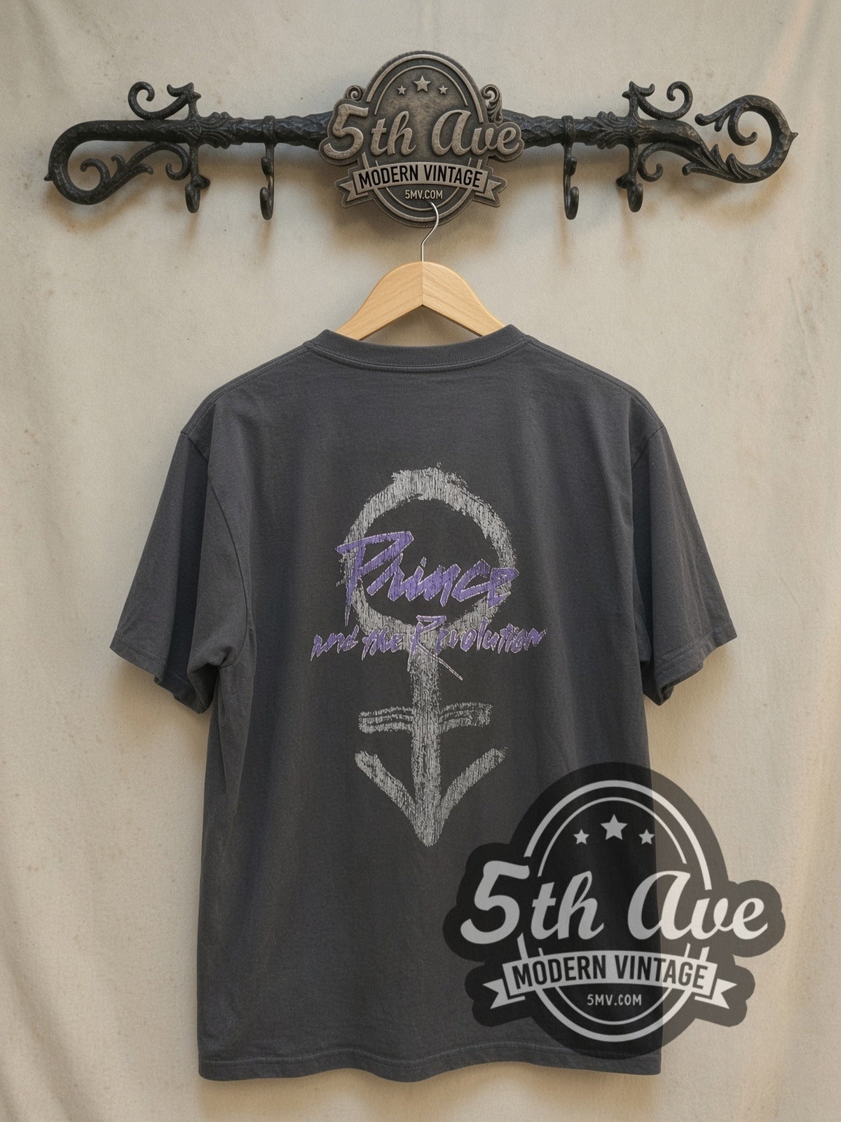 Prince Purple Rain Motorcycle Movie Poster vintage band t-shirt, back view on a display rack