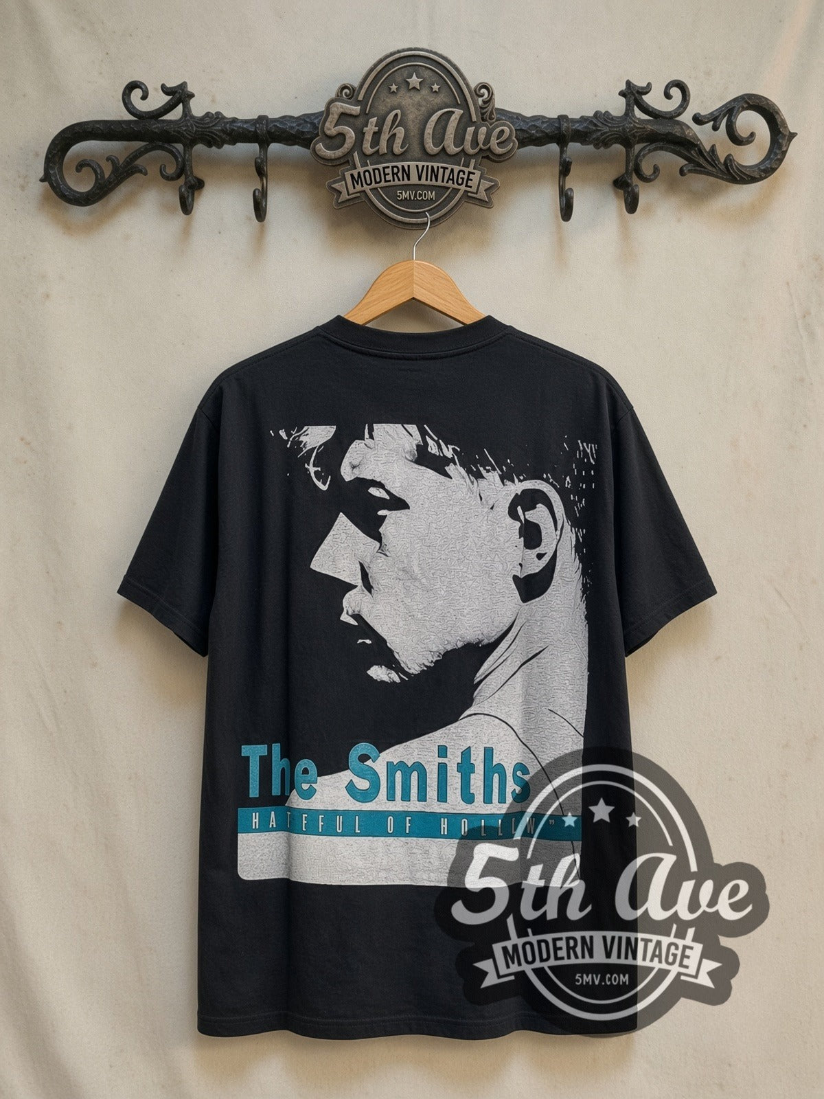 The Smiths Hatful of Hollow Blue Title Bar Portrait vintage band t-shirt in black, back view on a display rack