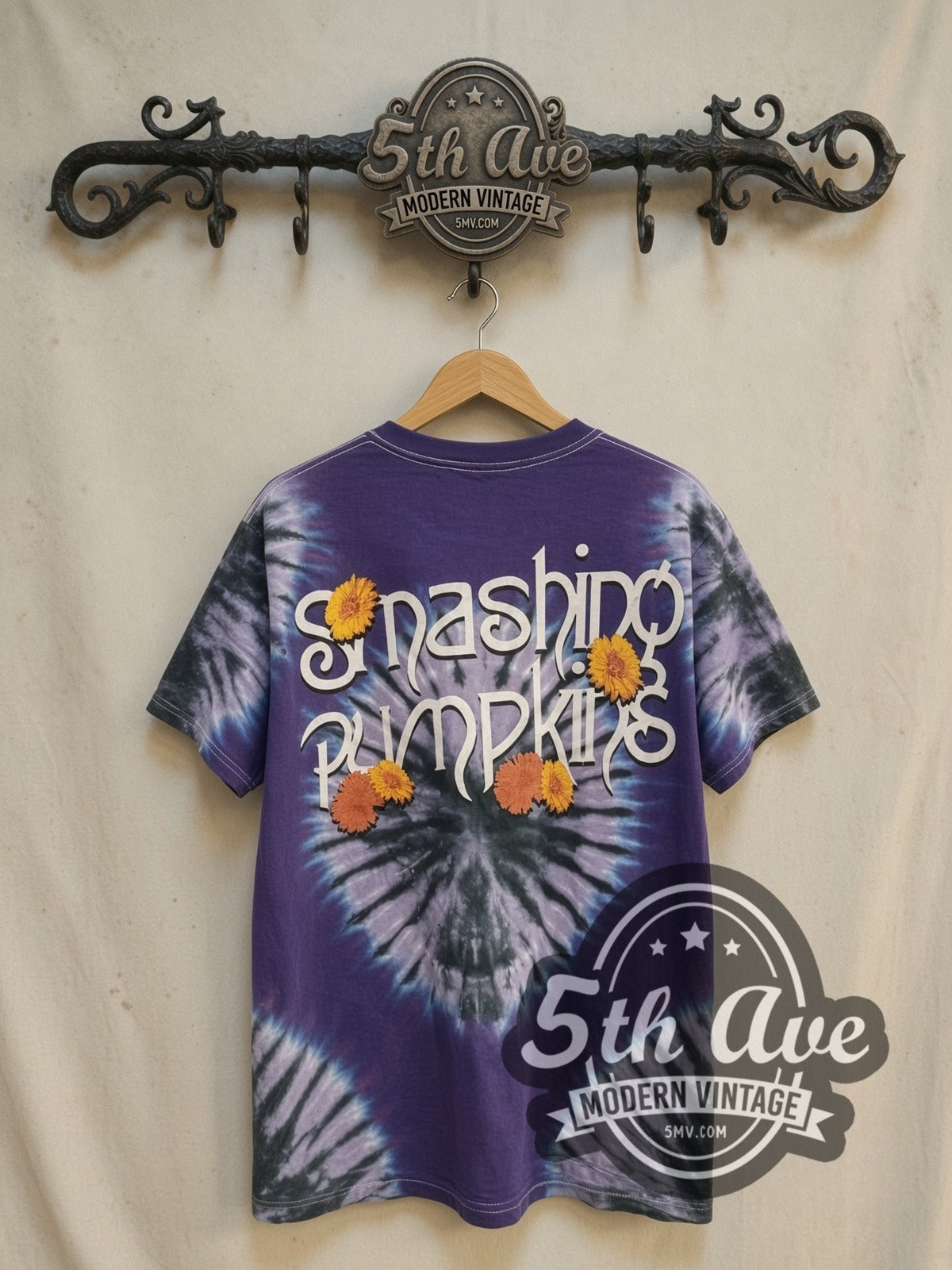 The Smashing Pumpkins The Infinite Sadness Tour Tie Dye vintage band t-shirt, back view on a display rack