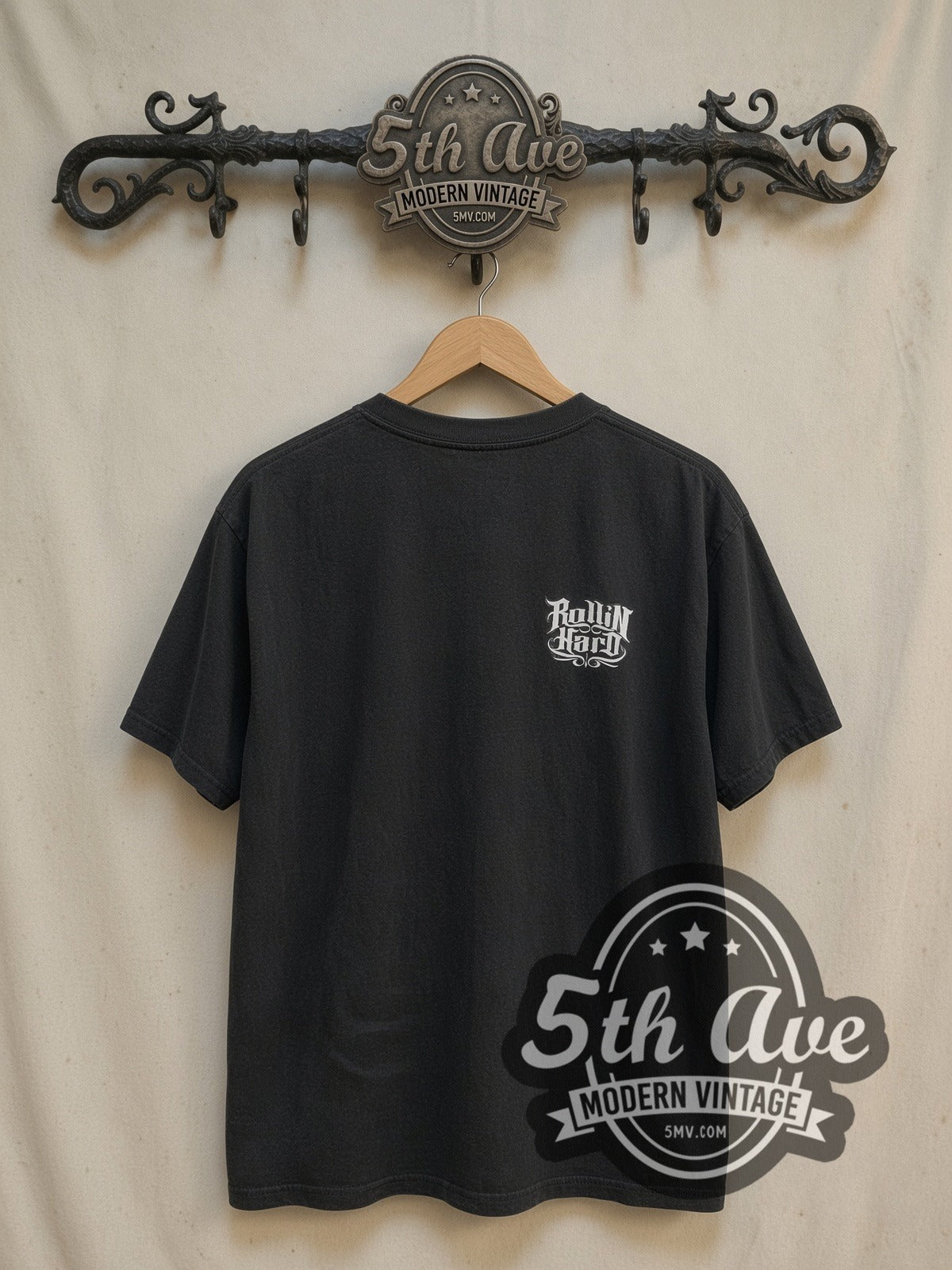 Rollin Hard Low Rider Culture Tribute vintage graphic tee, back view on a display rack