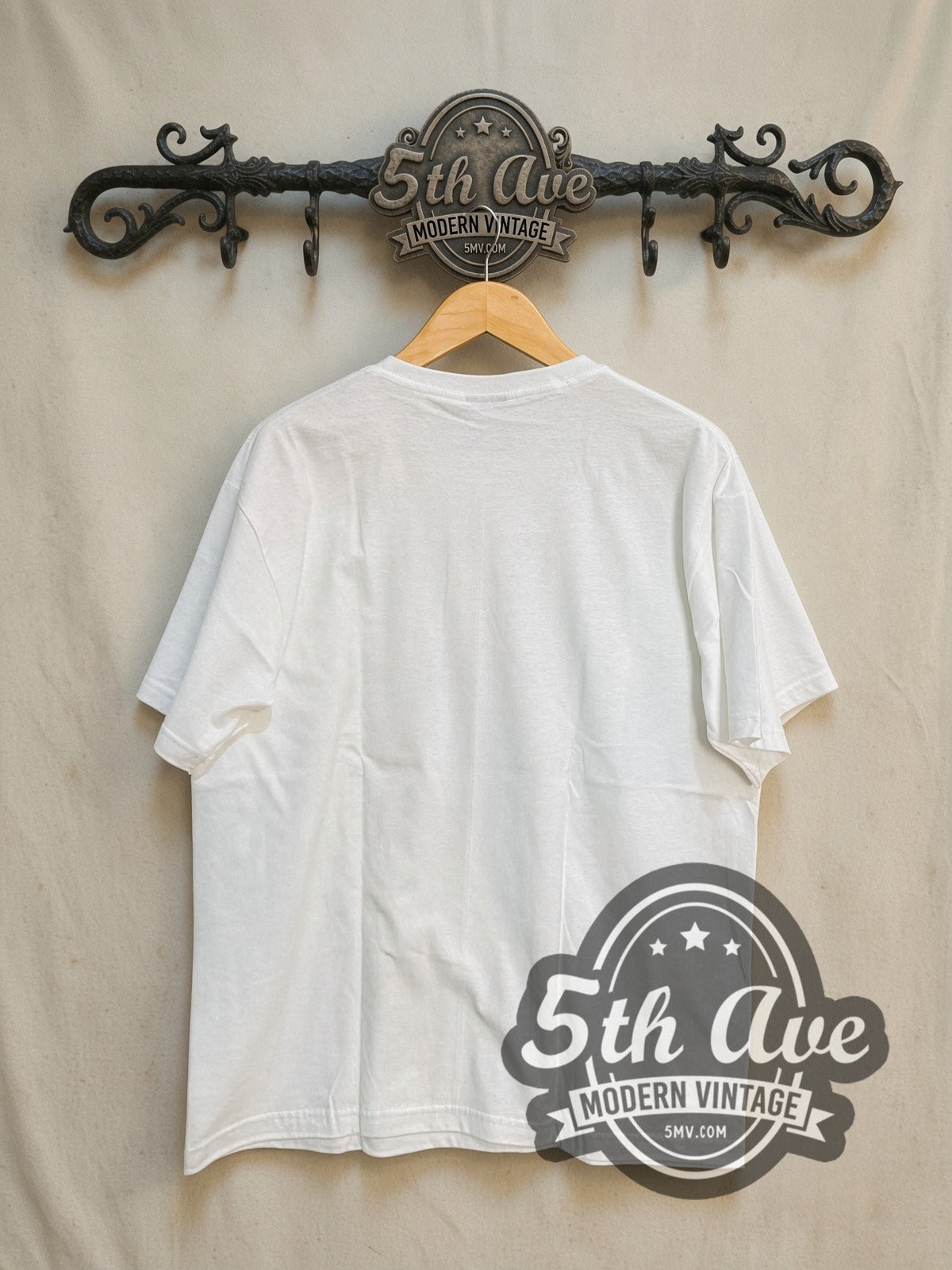 The Beatles Cigarettes vintage band t-shirt, back view on a display rack