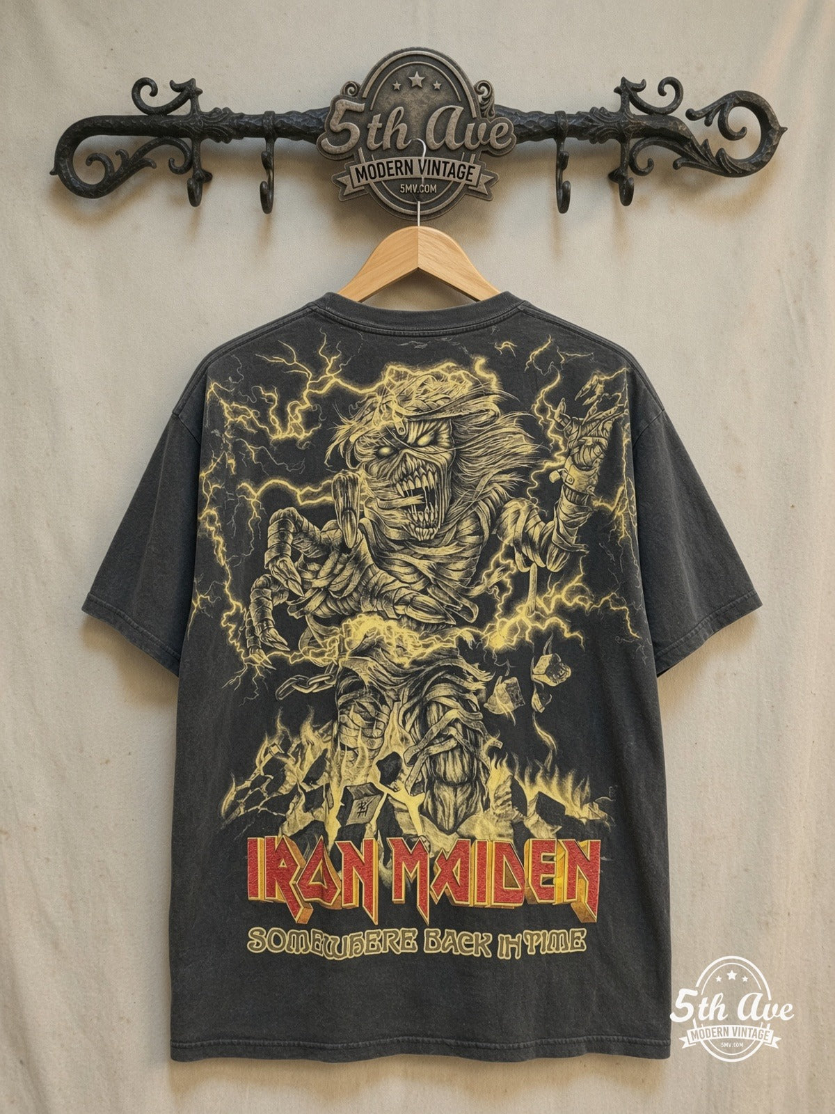 Iron Maiden – Somewhere Back in Time – All Over Print – Vintage Band T-Shirt — back on locked cream ornate 5th Ave rack