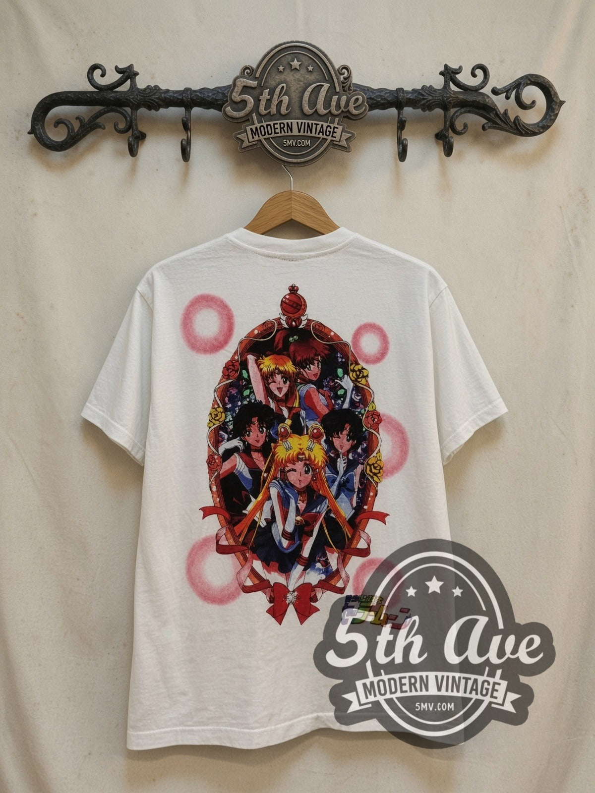 Sailor Moon Full Crew Tribute vintage graphic t-shirt, back view on a display rack