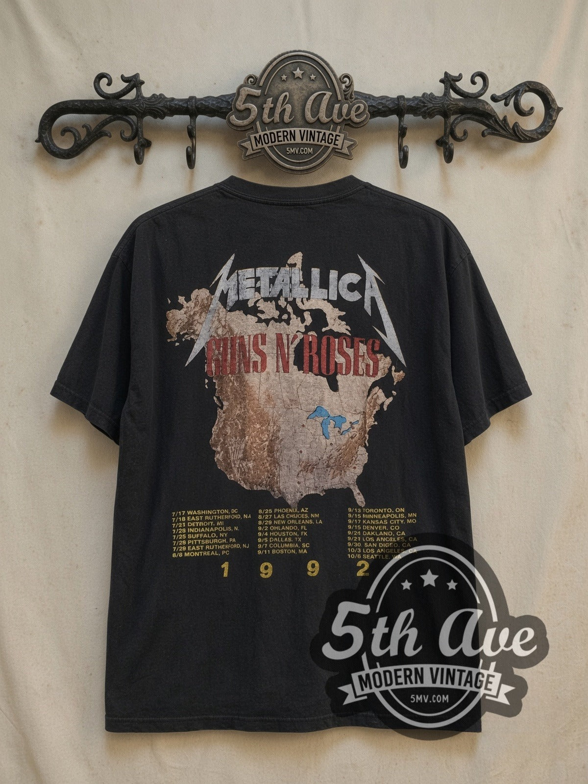 Guns N' Roses and Metallica 1992 Stadium Tour vintage band t-shirt, back view on a display rack