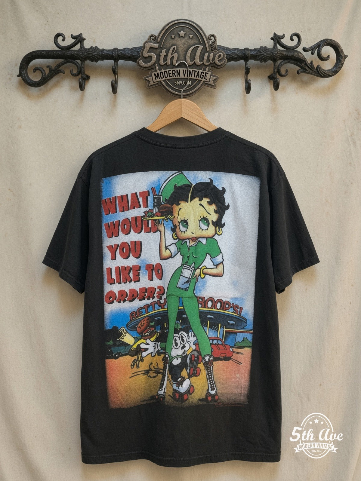 Betty Boop – What Would You Like to Order – All Over Print – New Vintage Graphic Tee — back on locked cream ornate 5th Ave rack