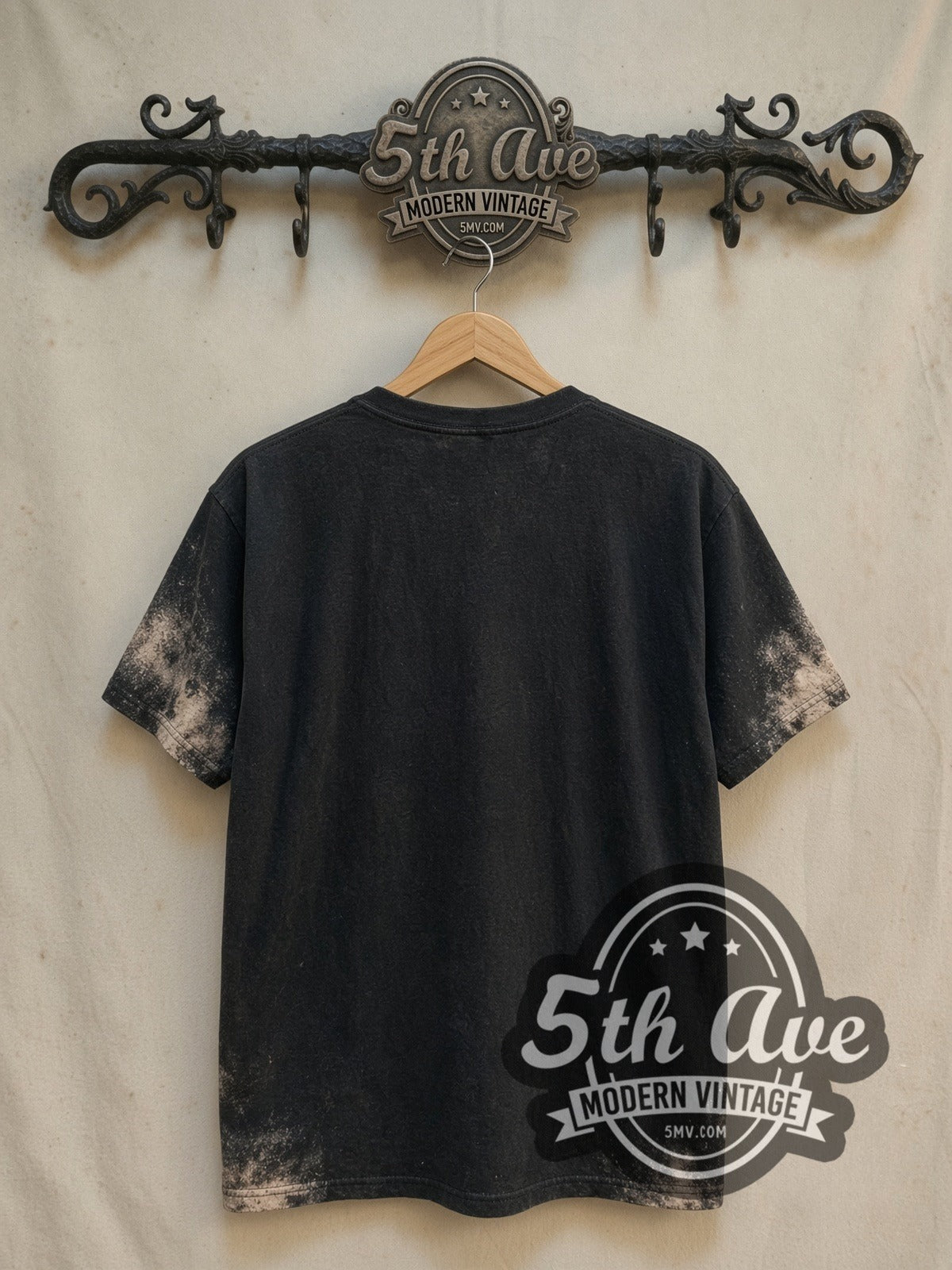 The Beatles Live Stage Ludwig Drum all-over-print vintage band t-shirt in black, back view on a display rack