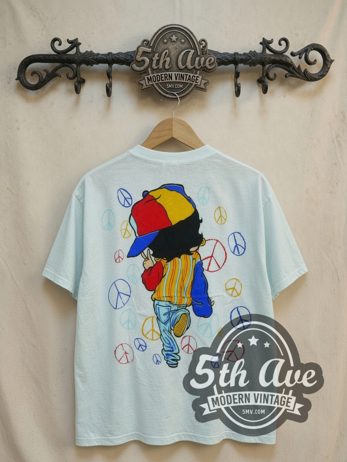 Betty Boop Peace all-over-print vintage cartoon t-shirt, back view on a display rack