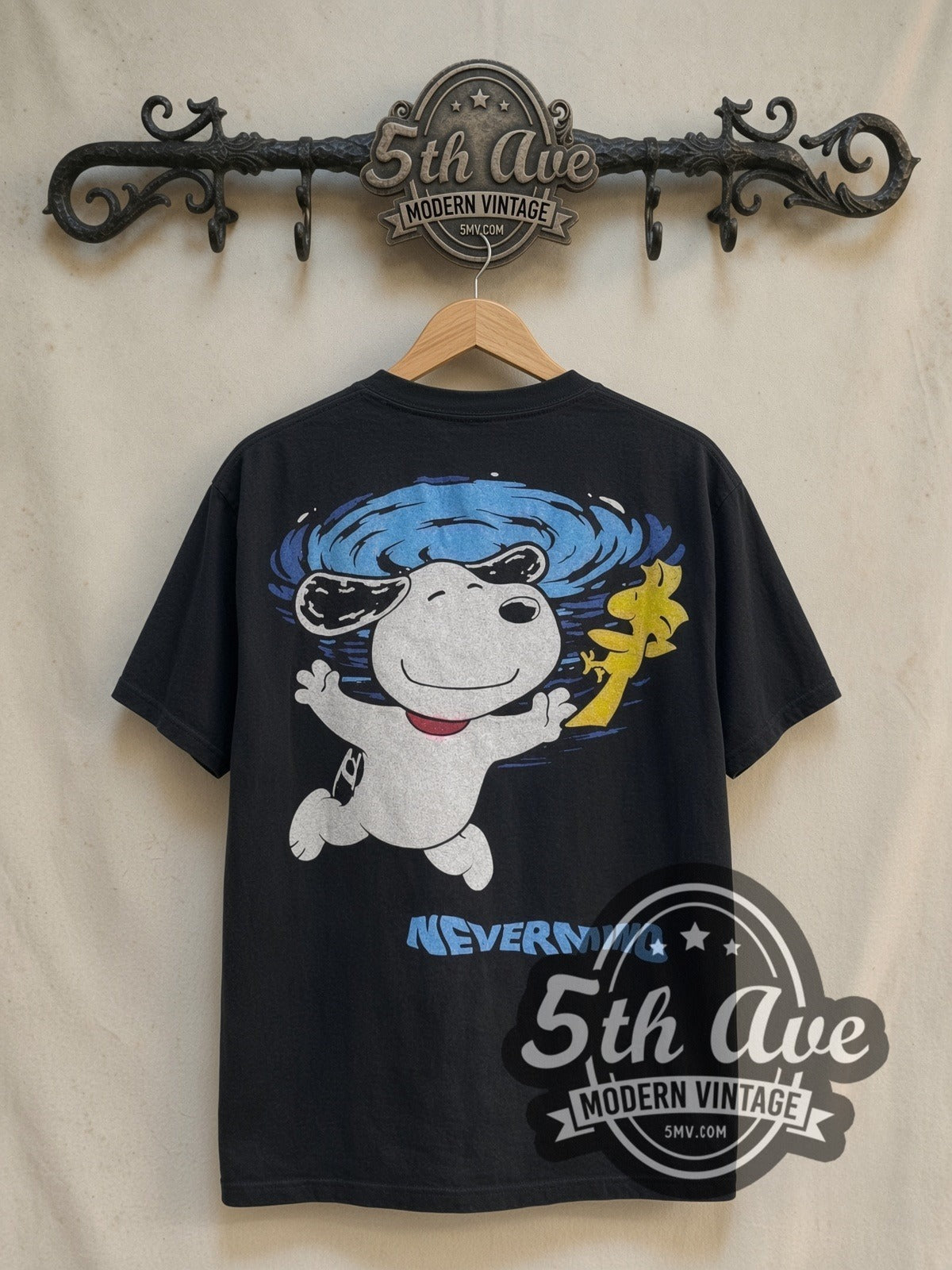Nirvana x Peanuts Nevermind Snoopy vintage cartoon tee in black, back view on a display rack
