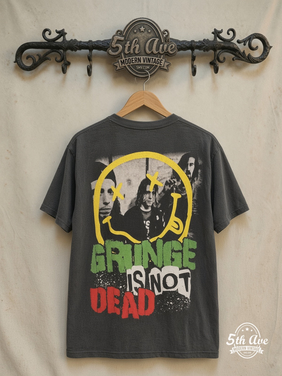 Kurt Cobain / Nirvana – Bootleg Graphic – Vintage Band T-Shirt — back on locked cream ornate 5th Ave rack