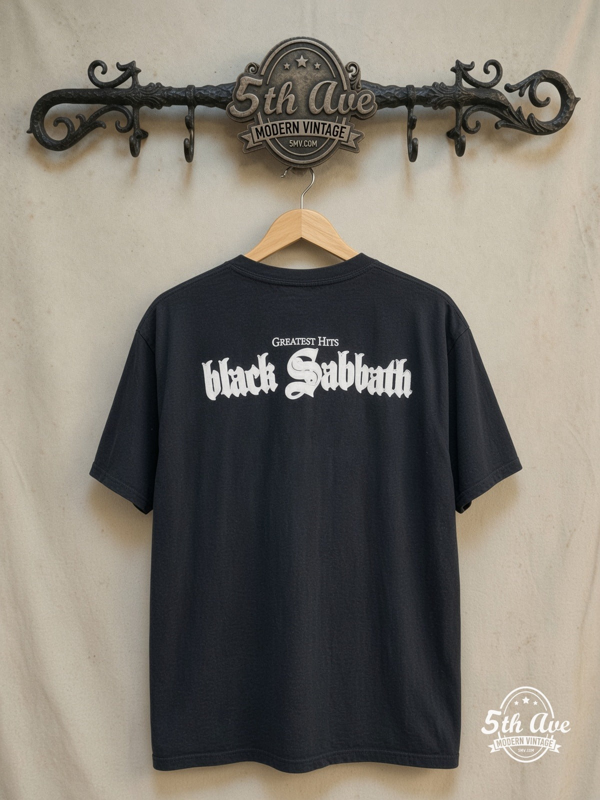 Black Sabbath – Greatest Hits – Vintage Band T-Shirt — back on locked cream ornate 5th Ave rack