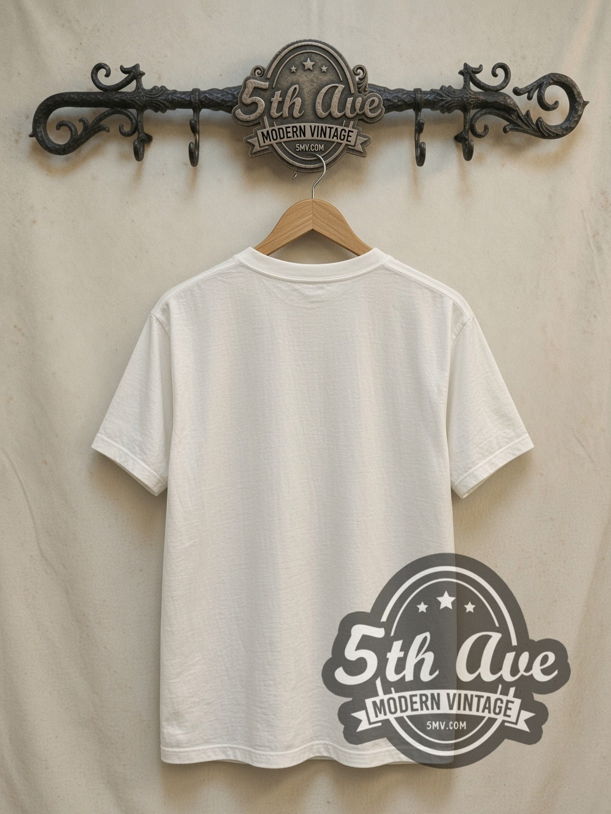The Allman Brothers Band Black Distressed Script Logo vintage band t-shirt in white, back view on a display rack