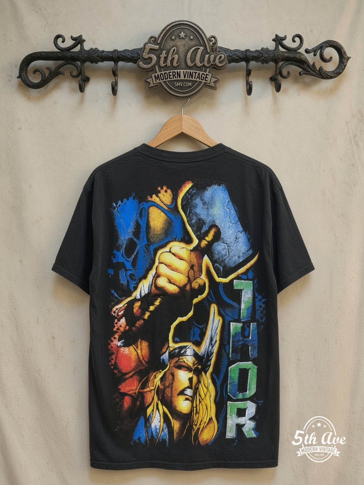 Marvel – Thor Odinson Mjolnir Comic Black All Over Print – Vintage Graphic Tee — back on locked cream ornate 5th Ave rack