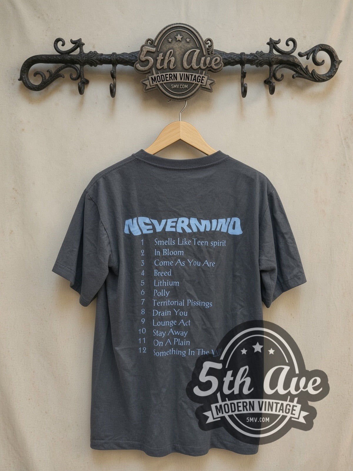 Nirvana Nevermind Baby Cover vintage band t-shirt, back view on a display rack