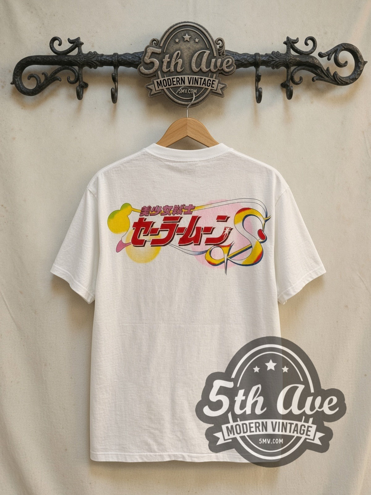 Sailor Moon Sailor Chibi Moon and Luna vintage graphic t-shirt, back view on a display rack