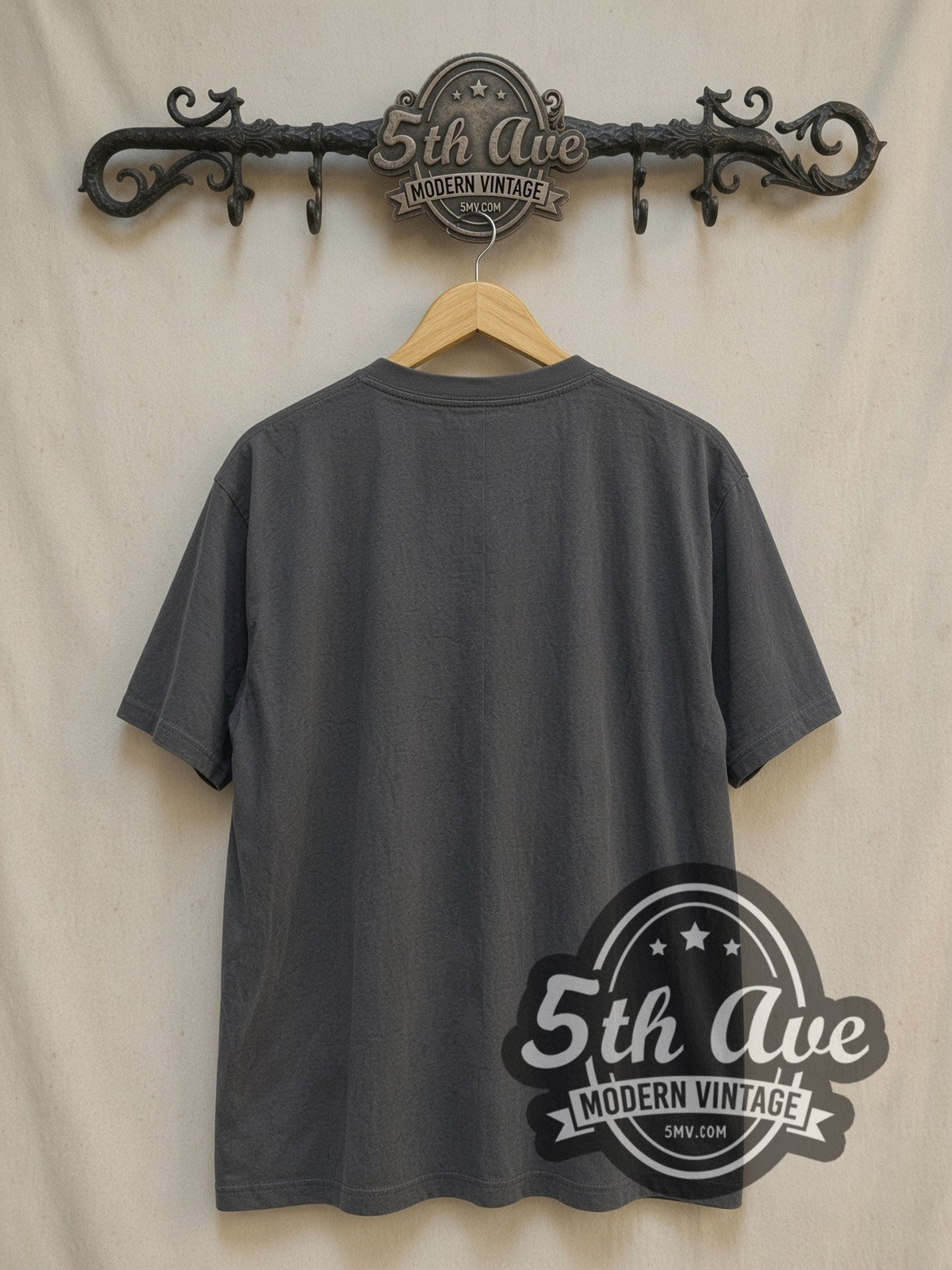 Iron Maiden Chained Eddie RIP Tombstone vintage band t-shirt, back view on a display rack