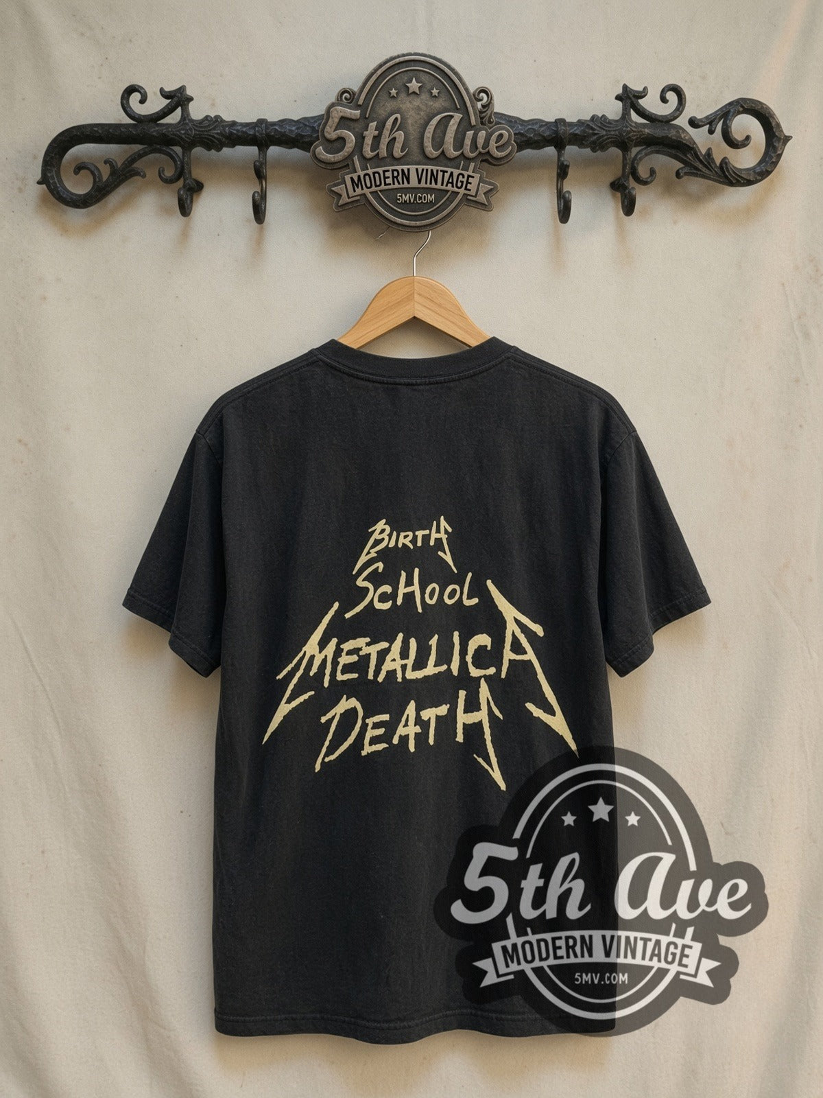 Metallica Birth School Four Members Crossed Arms vintage band t-shirt, back view on a display rack