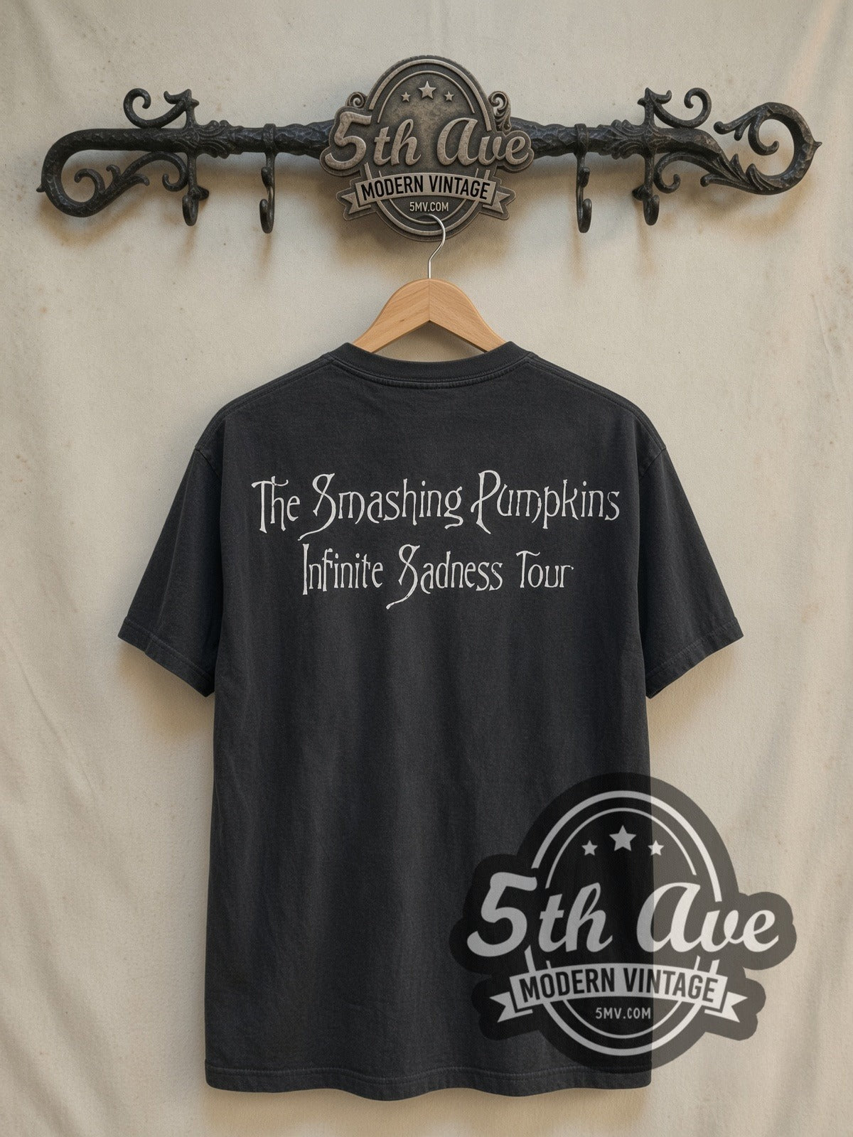 The Smashing Pumpkins Bullet with Butterfly Wings Tour vintage band t-shirt in black, back view on a display rack