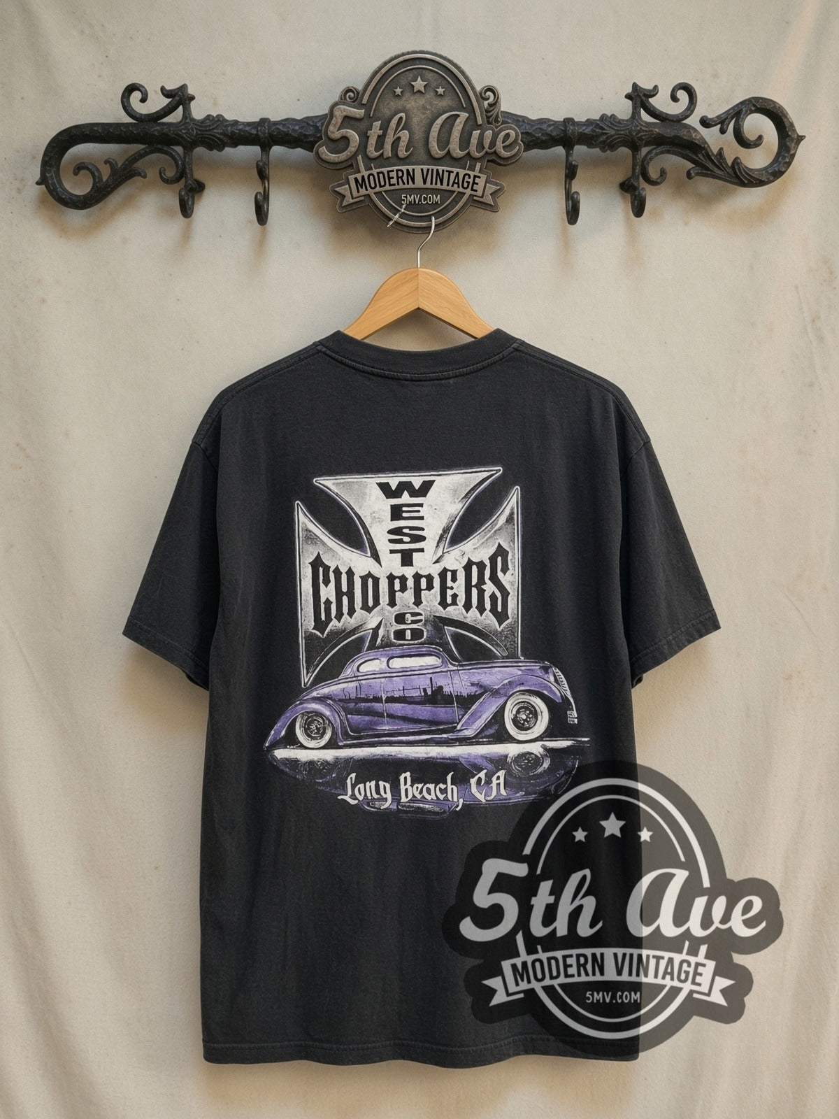 West Coast Choppers Long Beach Purple Hot Rod Iron Cross vintage biker tee in black, back view on a display rack