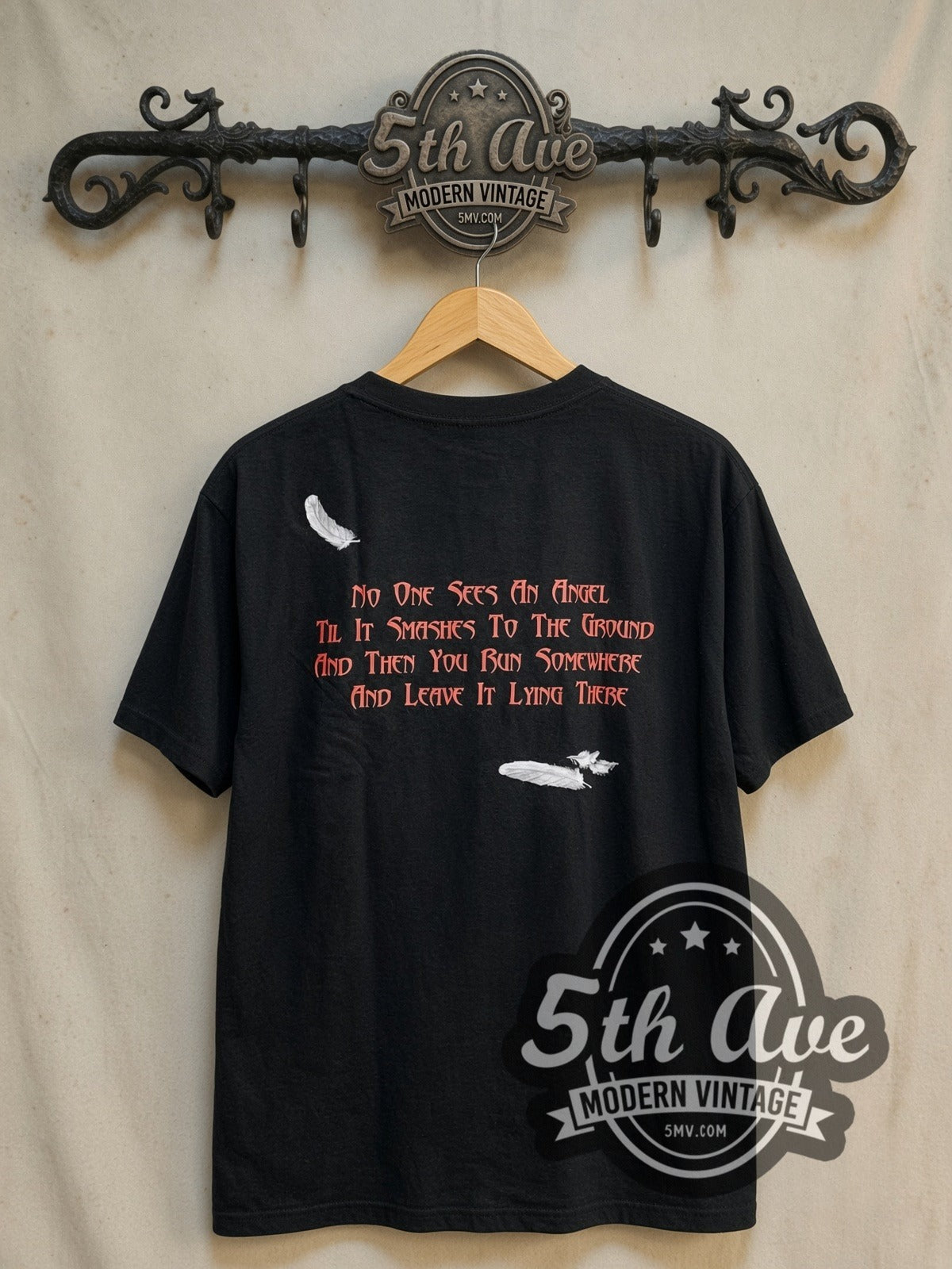 Dio Holy Diver Full Scene Priest Drowning vintage band t-shirt, back view on a display rack