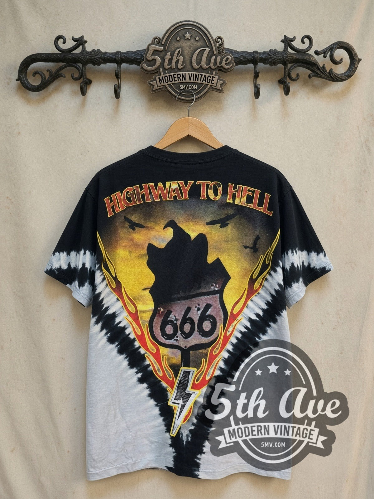 AC/DC Highway to Hell Flame V Black Grey Tie-Dye vintage band t-shirt in black and grey tie-dye, back view on a display rack