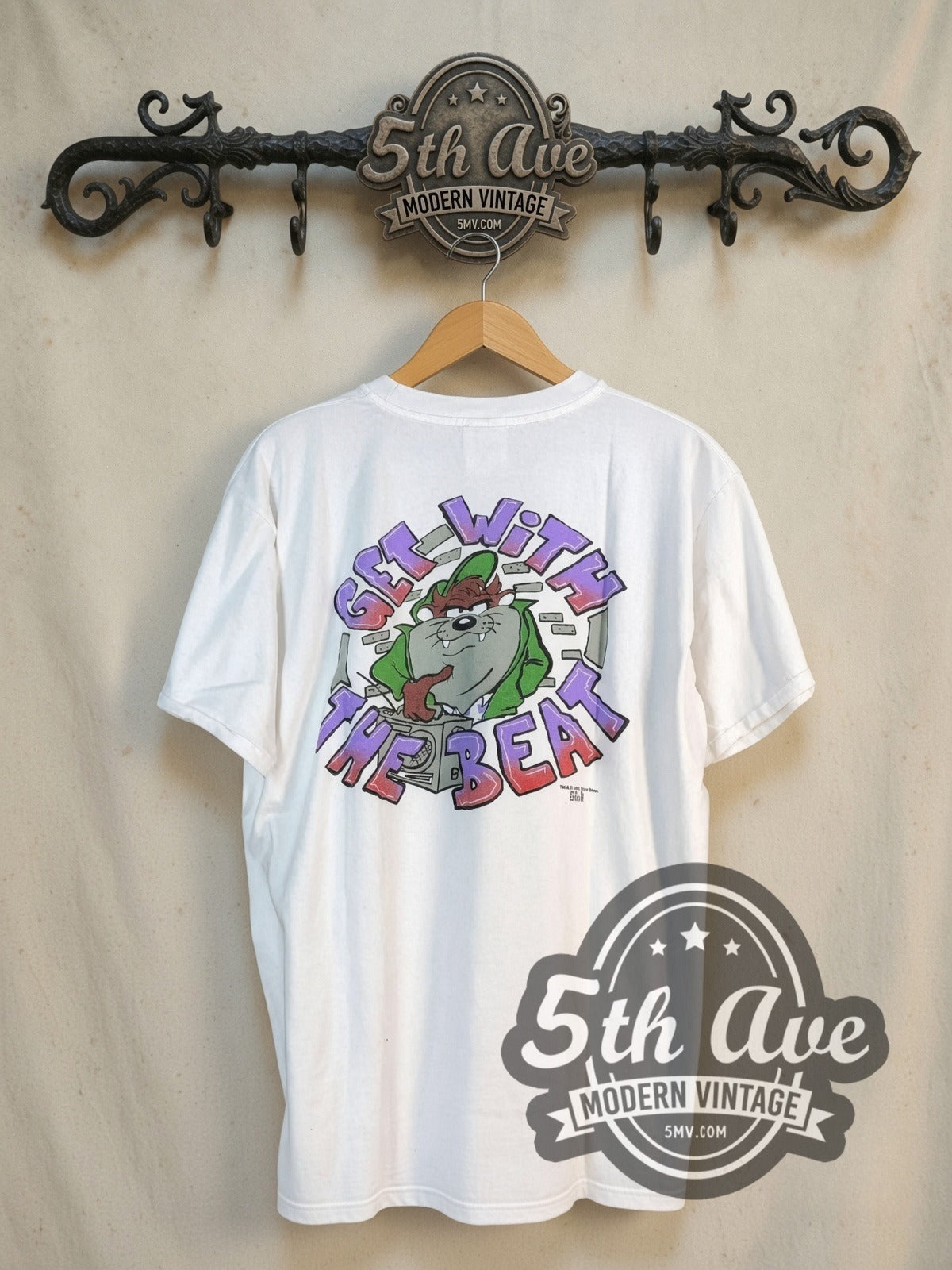 Looney Tunes Taz-Mania Classic Look all-over-print vintage cartoon tee, back view on a display rack
