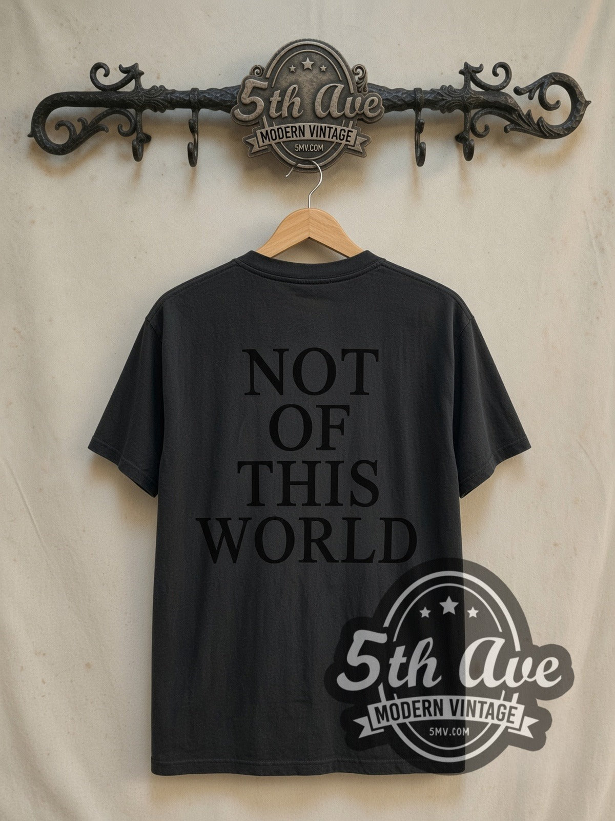 Dennis Rodman Not of This World graphic tee in black, back view on a display rack